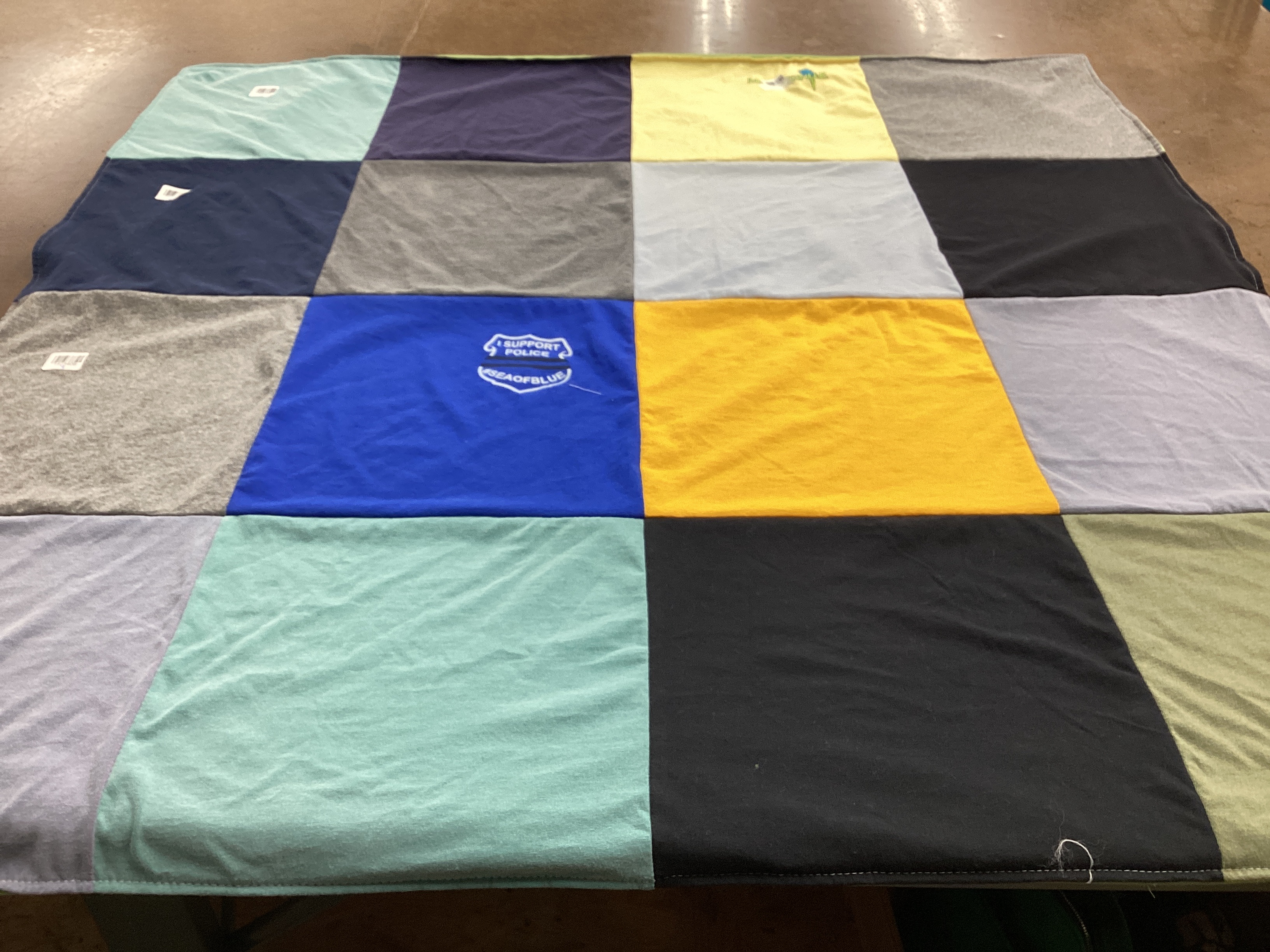 T-shirt quilt with law enforcement, community support themes by Deborah from OH