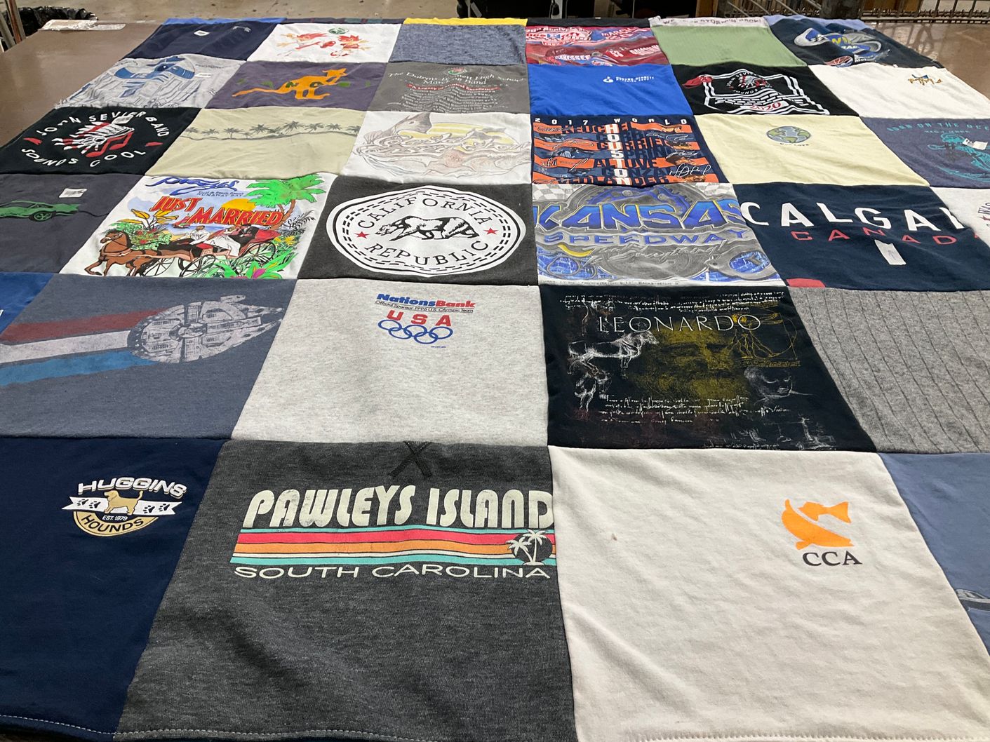 T-shirt quilt with travel, sports themes by Mia from TN