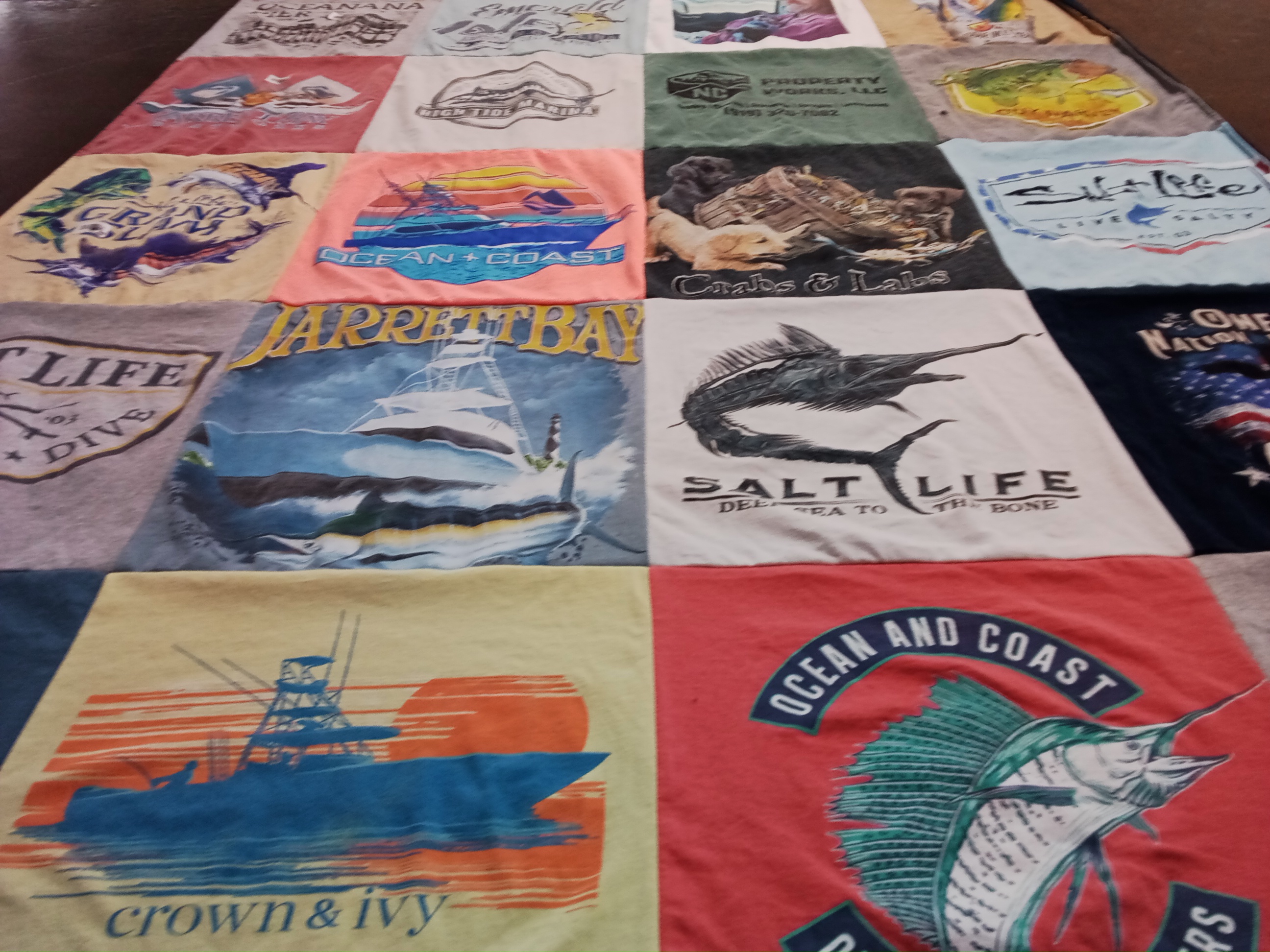 T-shirt quilt with fishing, marine life themes by Tammy from NC