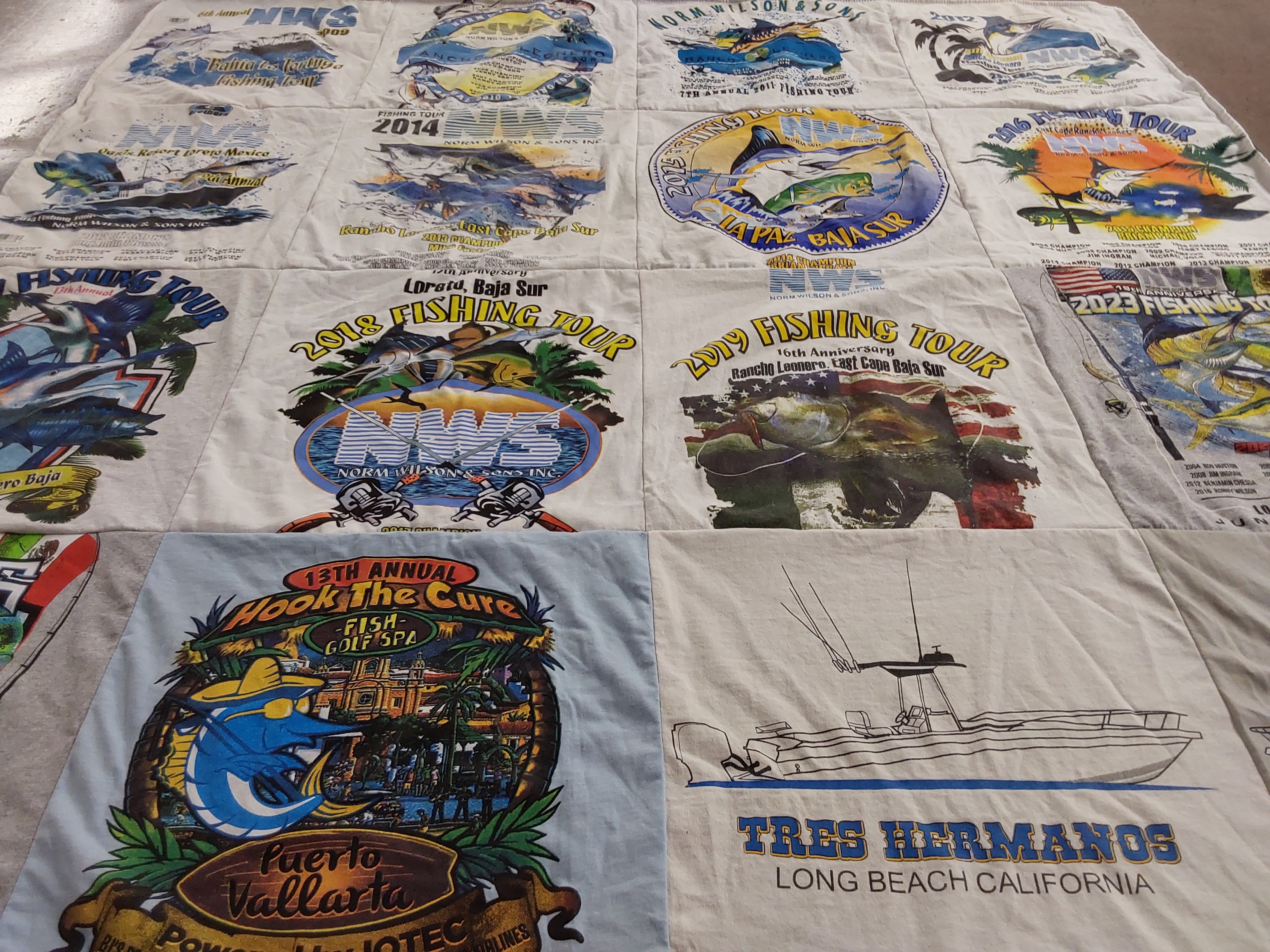 T-shirt quilt with fishing, travel themes by Sherri from CA