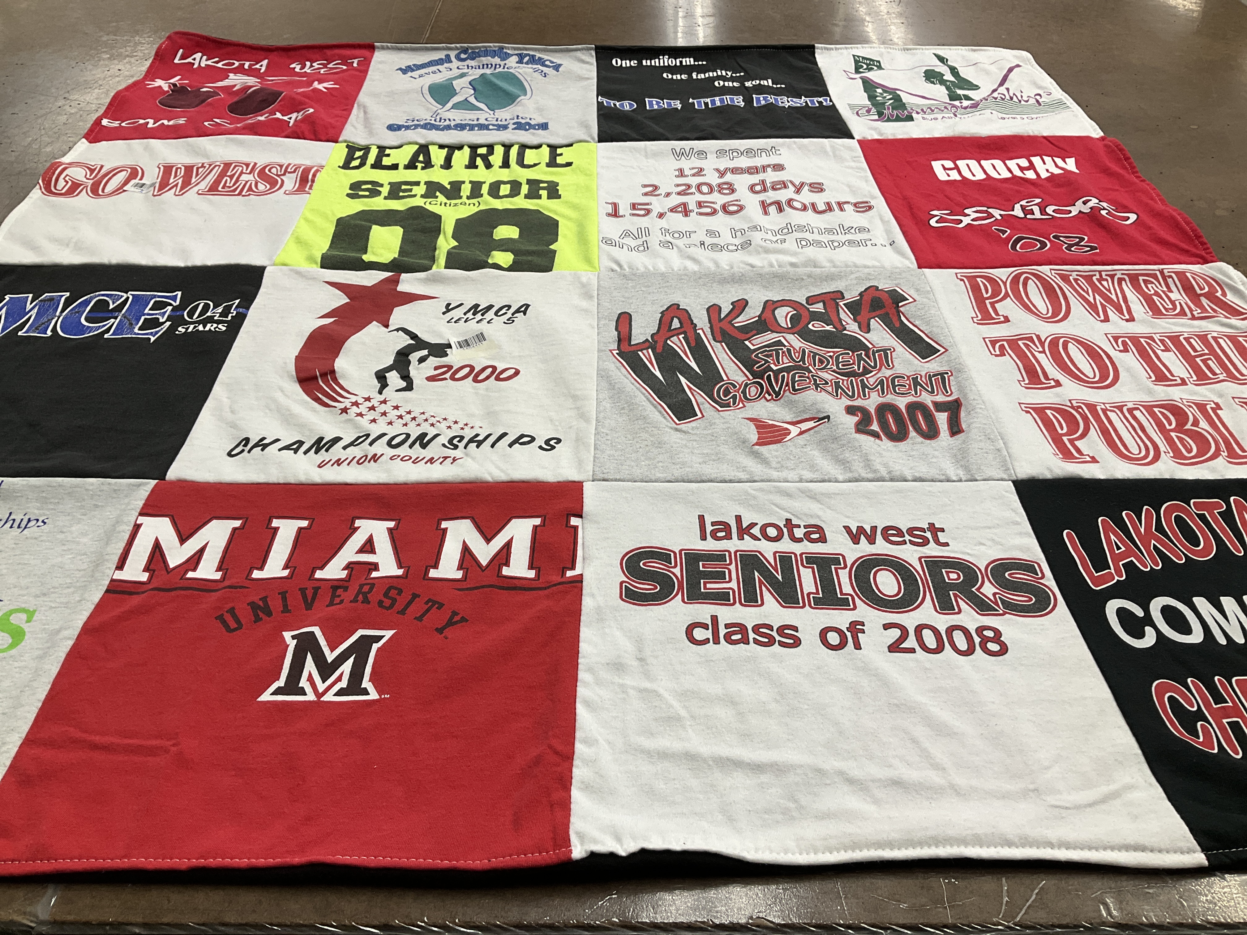 T-shirt quilt featuring lakota west, ymca by Cynthia from MI