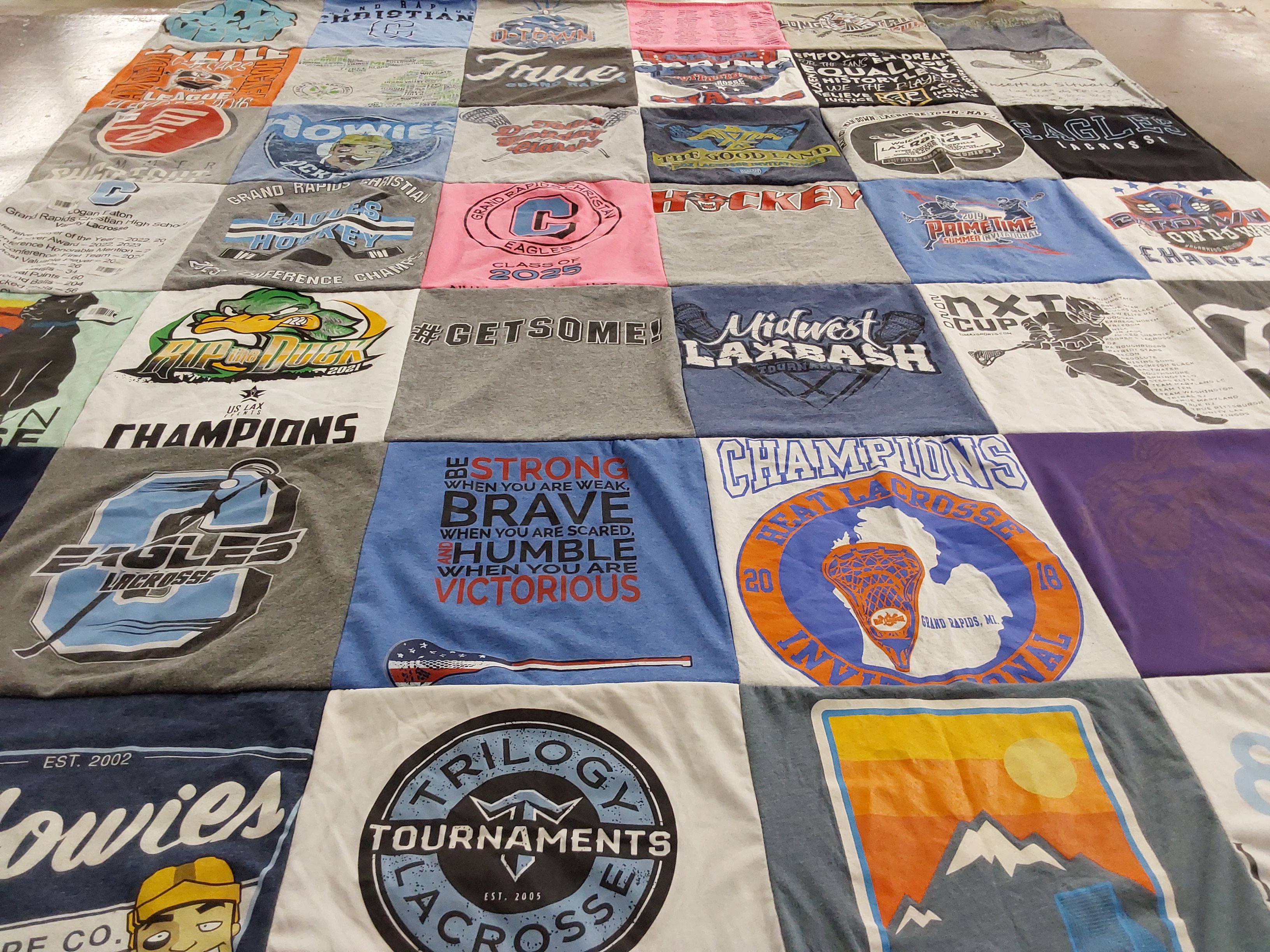 T-shirt quilt featuring grand rapids eagles lacrosse, team hockey by Amy from MI