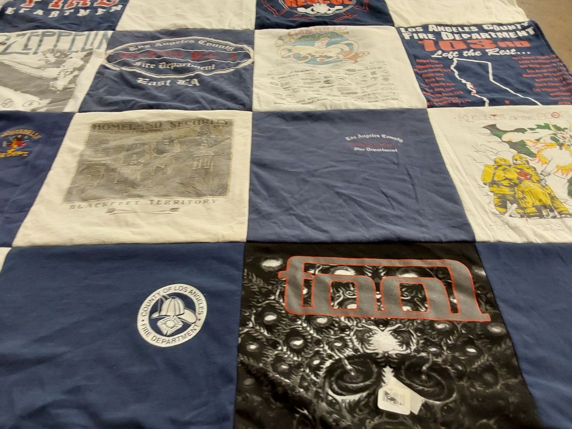 T-shirt quilt with firefighting, music themes by Debra from CA