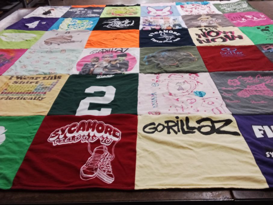 T-shirt quilt with music, art themes by June from MI