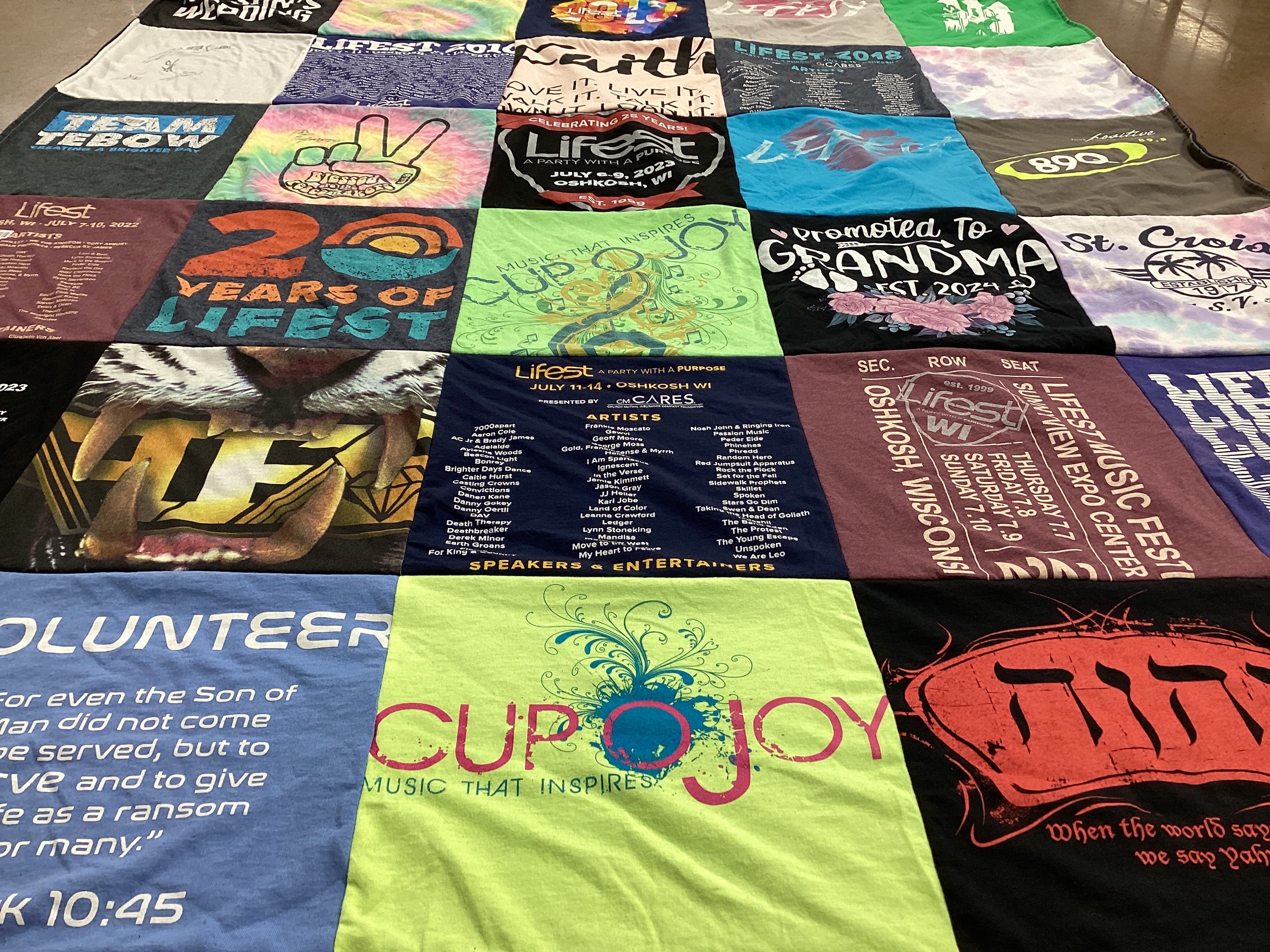 T-shirt quilt with music festivals, volunteering themes by Shanon from WI