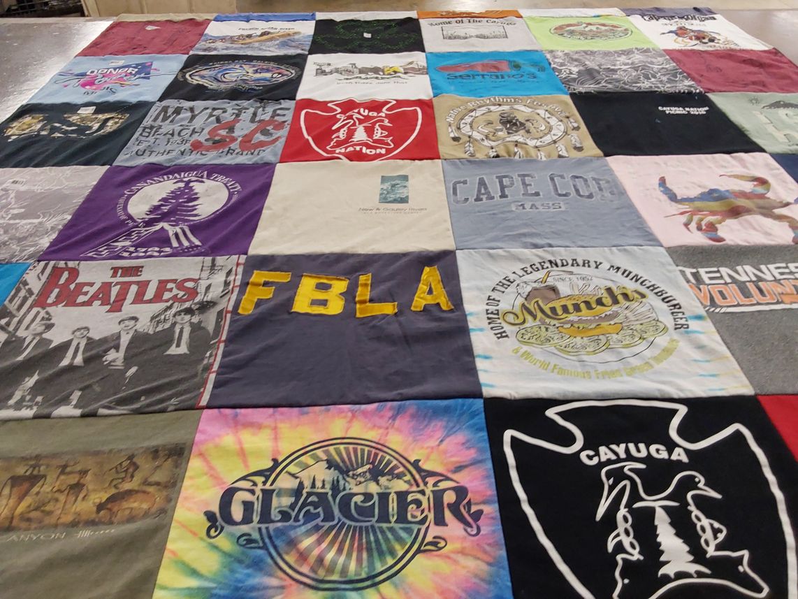 T-shirt quilt with music, travel themes by Gail from TN