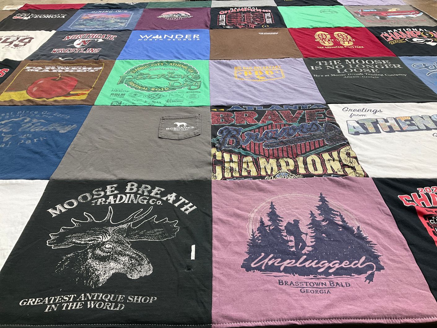 T-shirt quilt with hiking, sports themes by Reid from NV