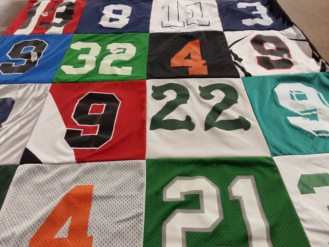 T-shirt quilt with sports, athletics themes by Candice from CA