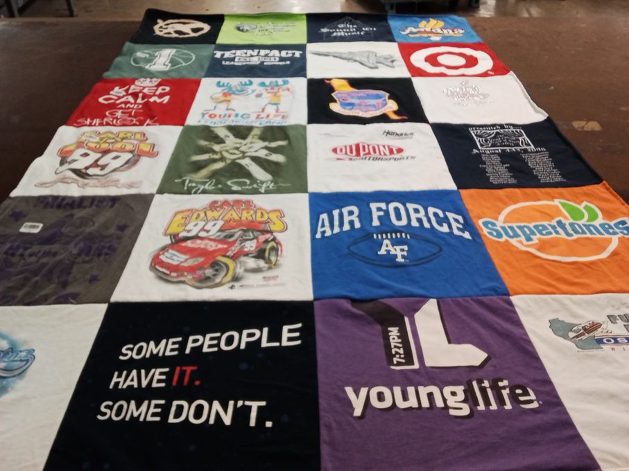 T-shirt quilt with nascar, music themes by Kim from CO