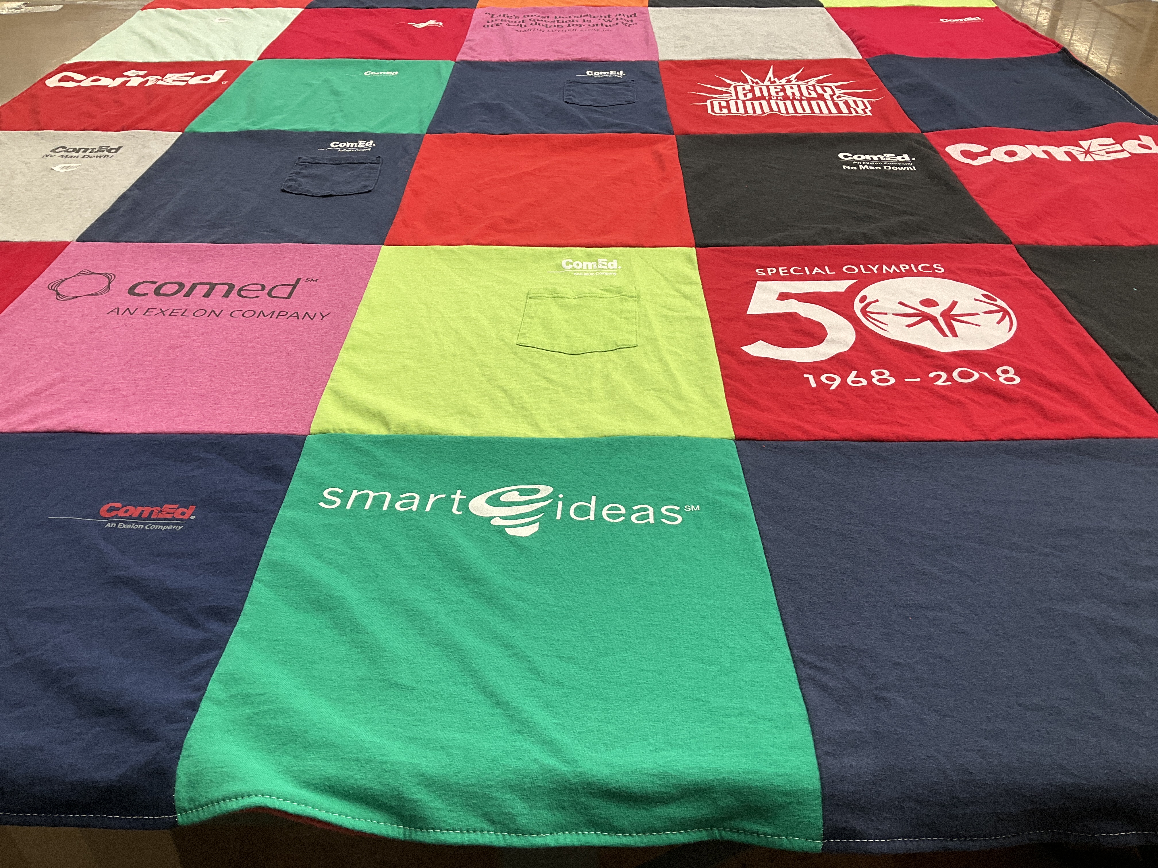 T-shirt quilt with sports, community service themes by CHERYL from IL