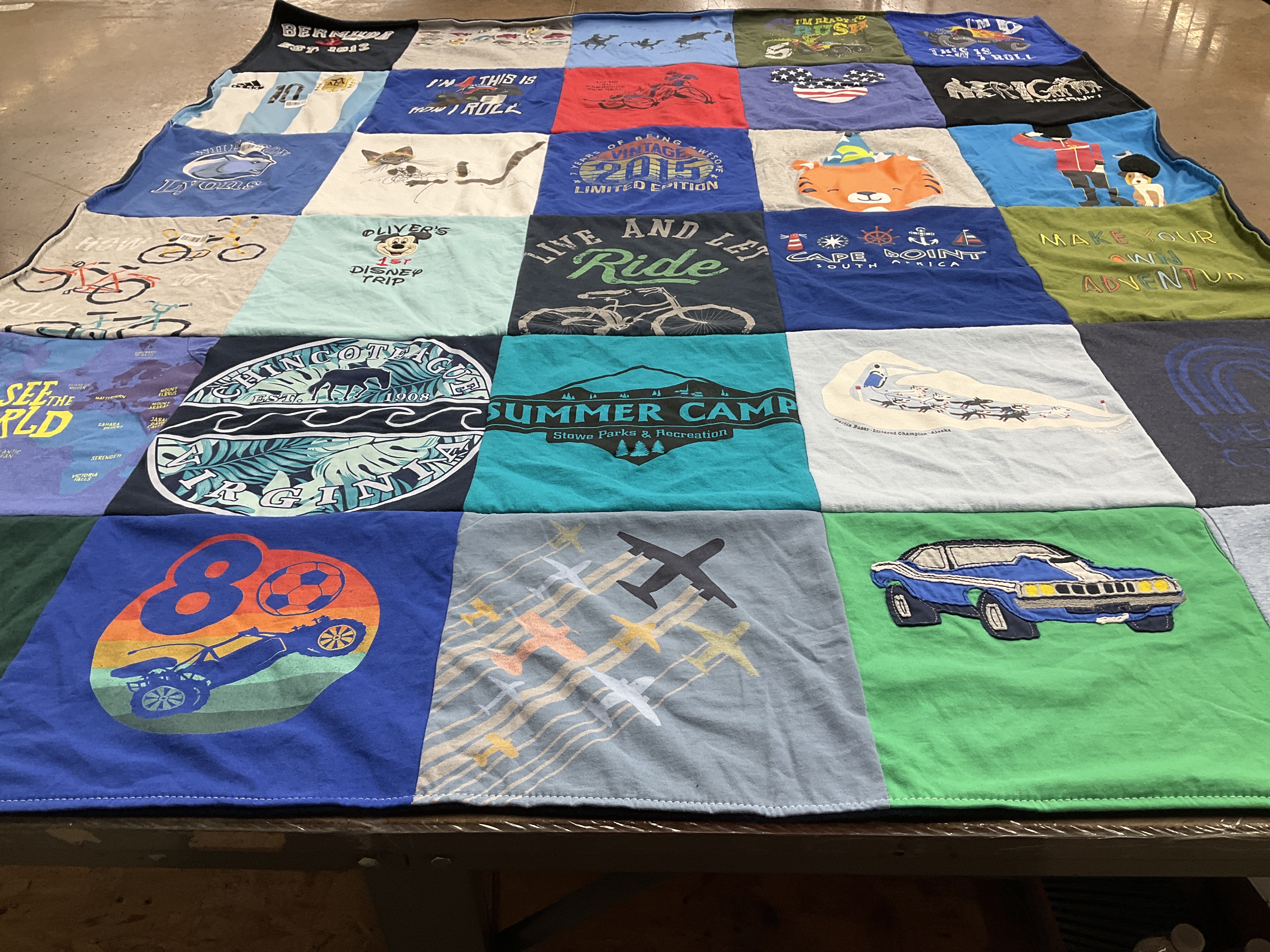 T-shirt quilt with travel, cycling themes by Caroline from MA