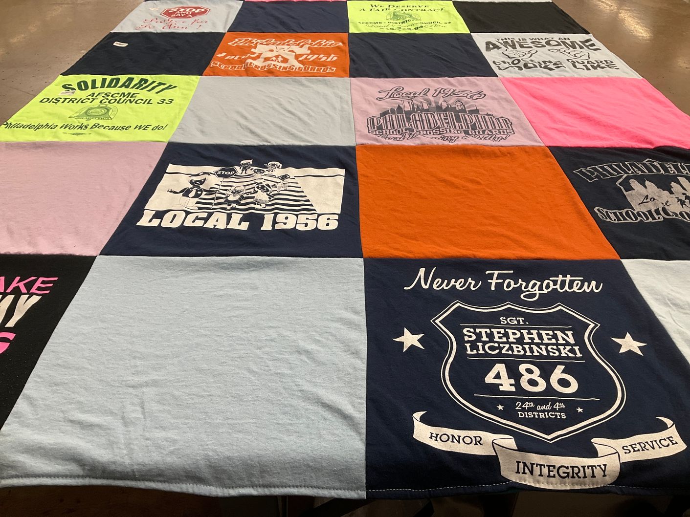 T-shirt quilt with labor rights, community support themes by Michele from PA