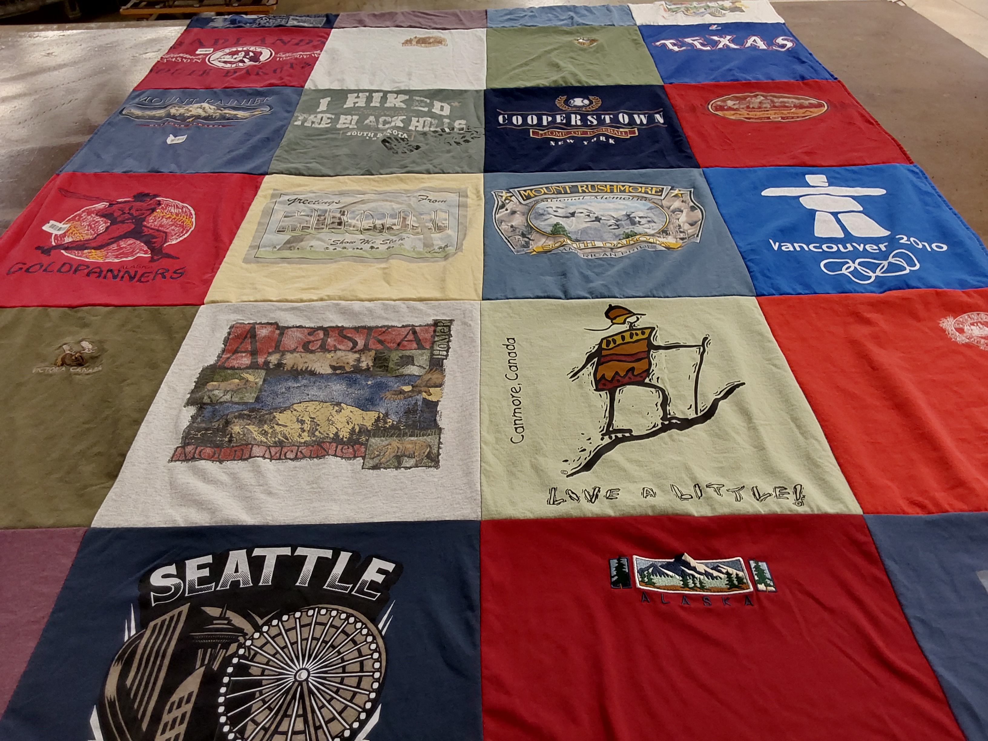 T-shirt quilt with hiking, traveling themes by Valerie from WA