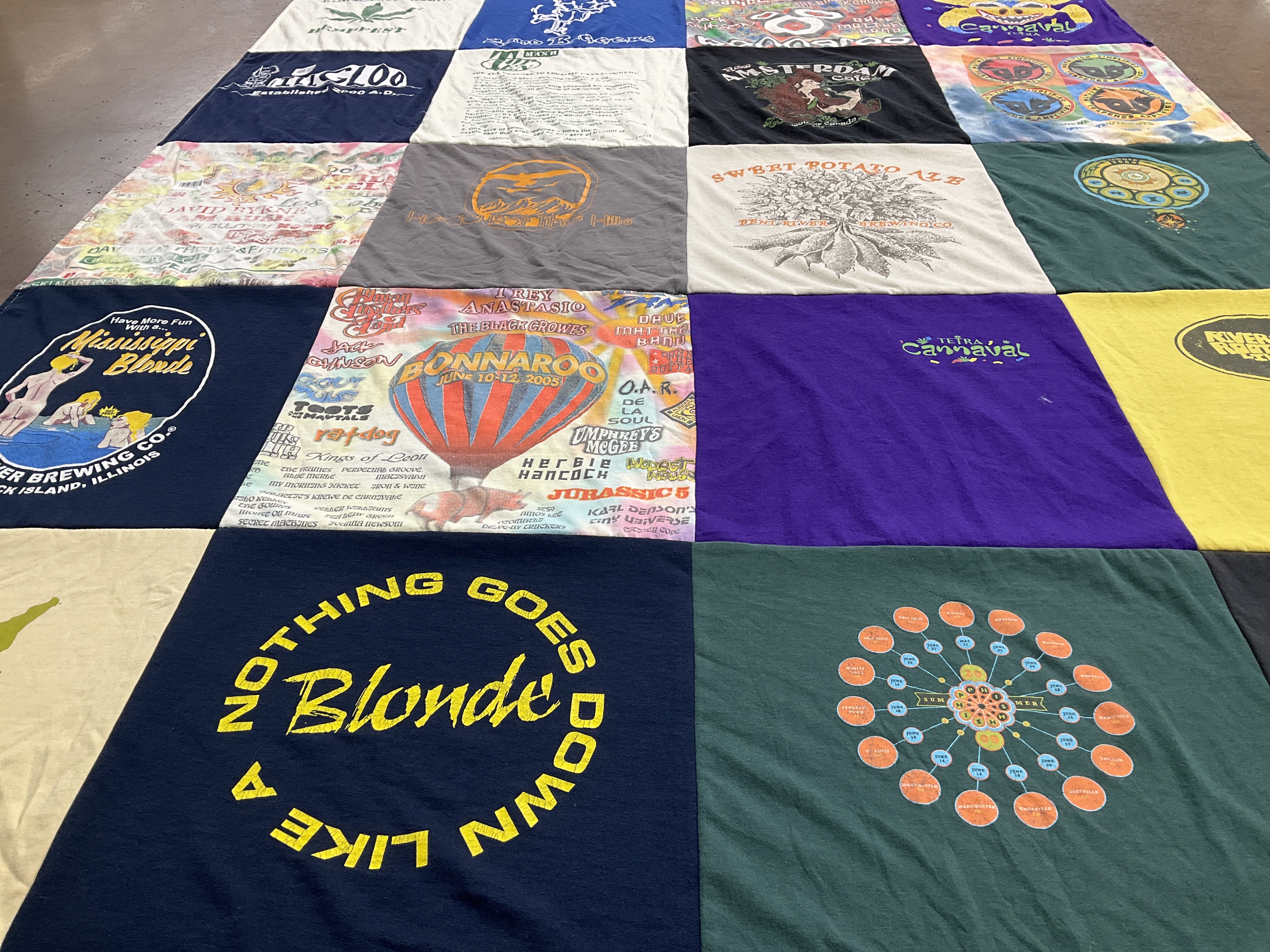 T-shirt quilt with music festivals, brewing themes by Mike from IL