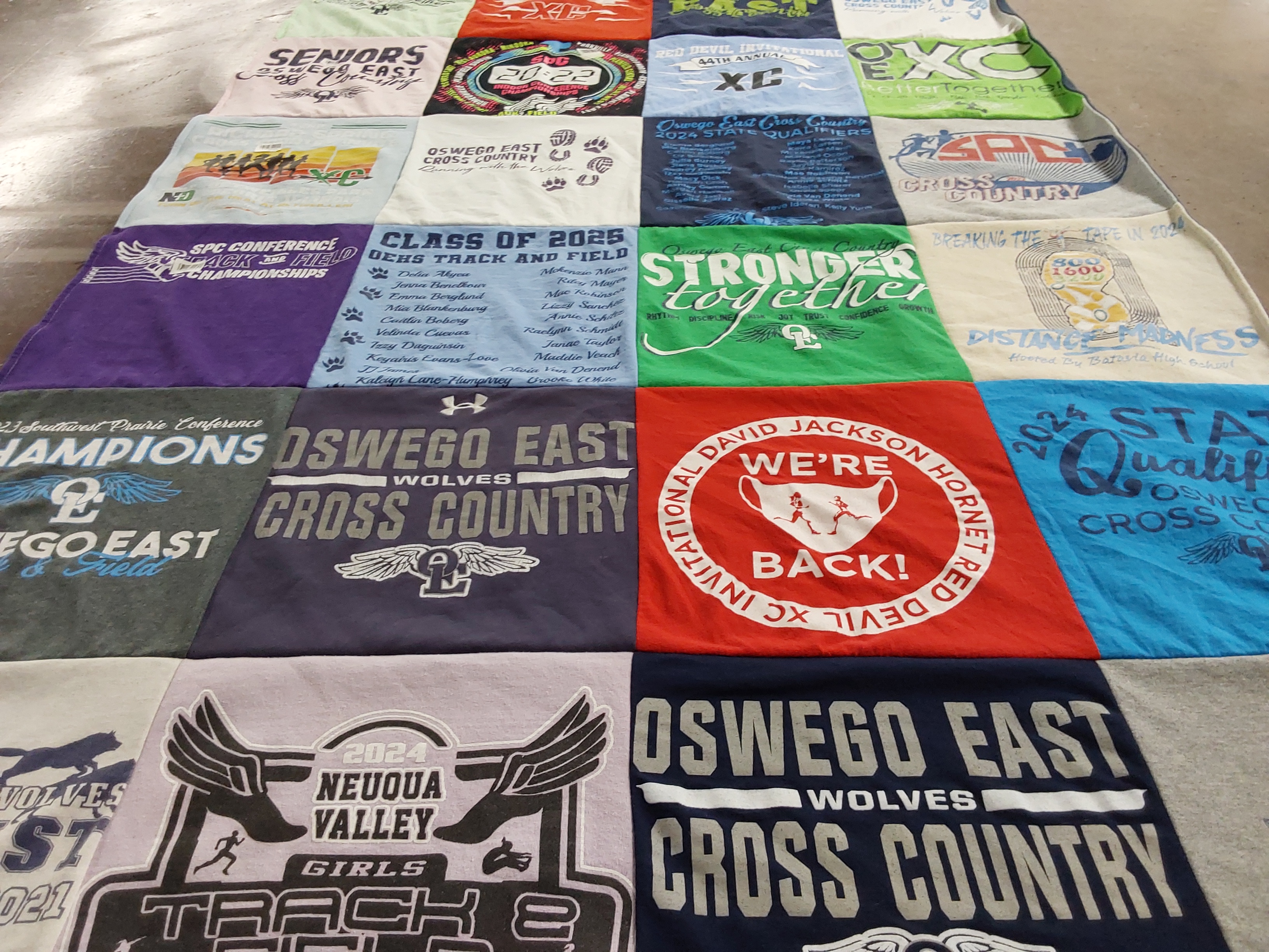 T-shirt quilt featuring oswego east wolves cross country, neuqua valley girls track and field by Janelle from IL