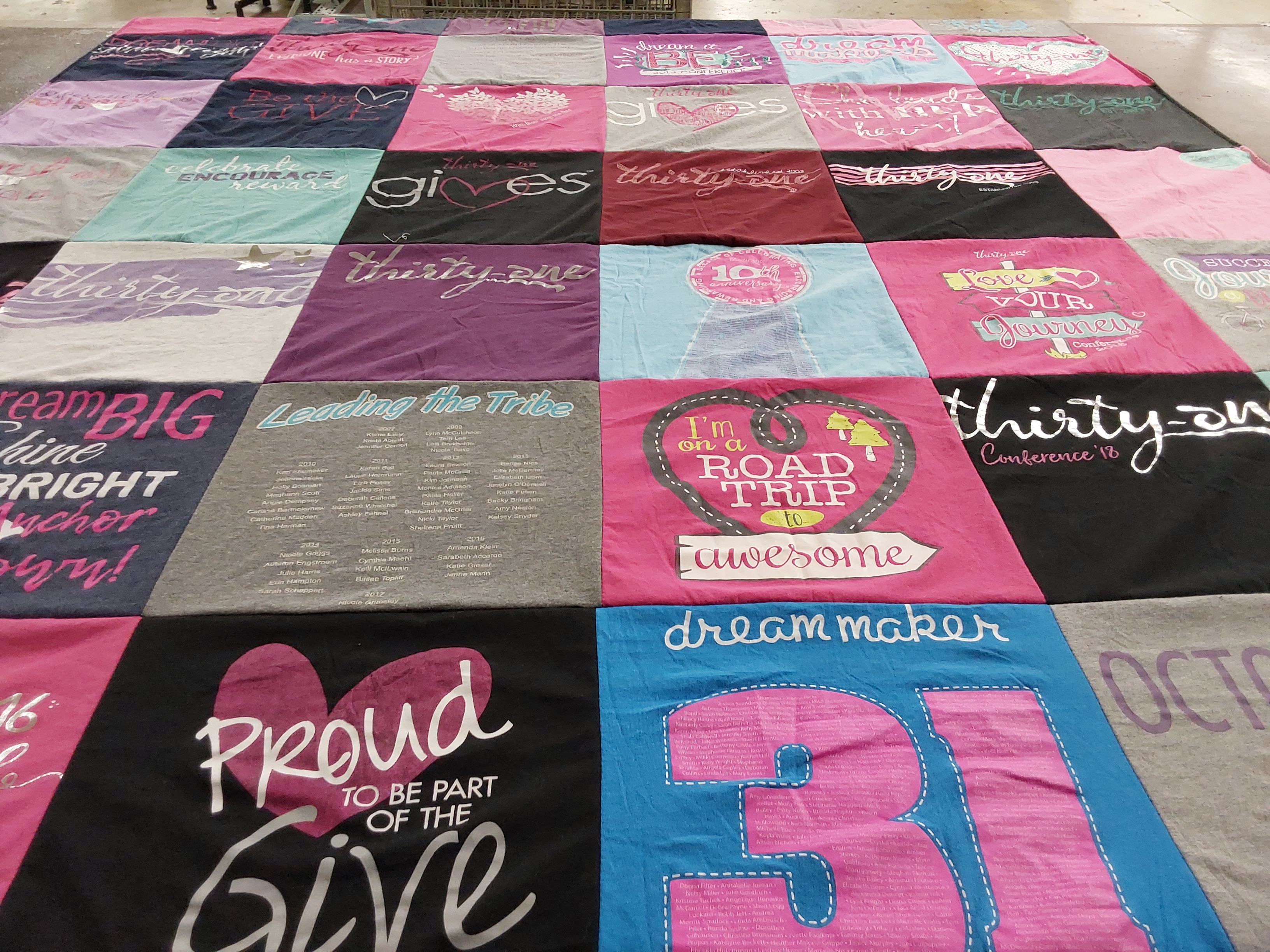 T-shirt quilt with community, uplifting themes by Mikki from FL