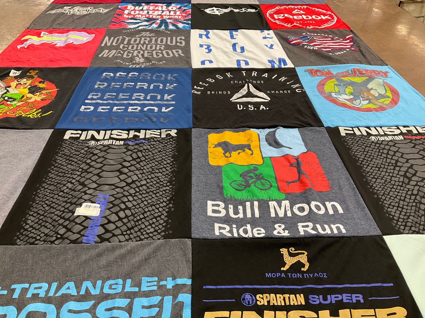 T-shirt quilt with fitness, sports themes by Bracken from NC