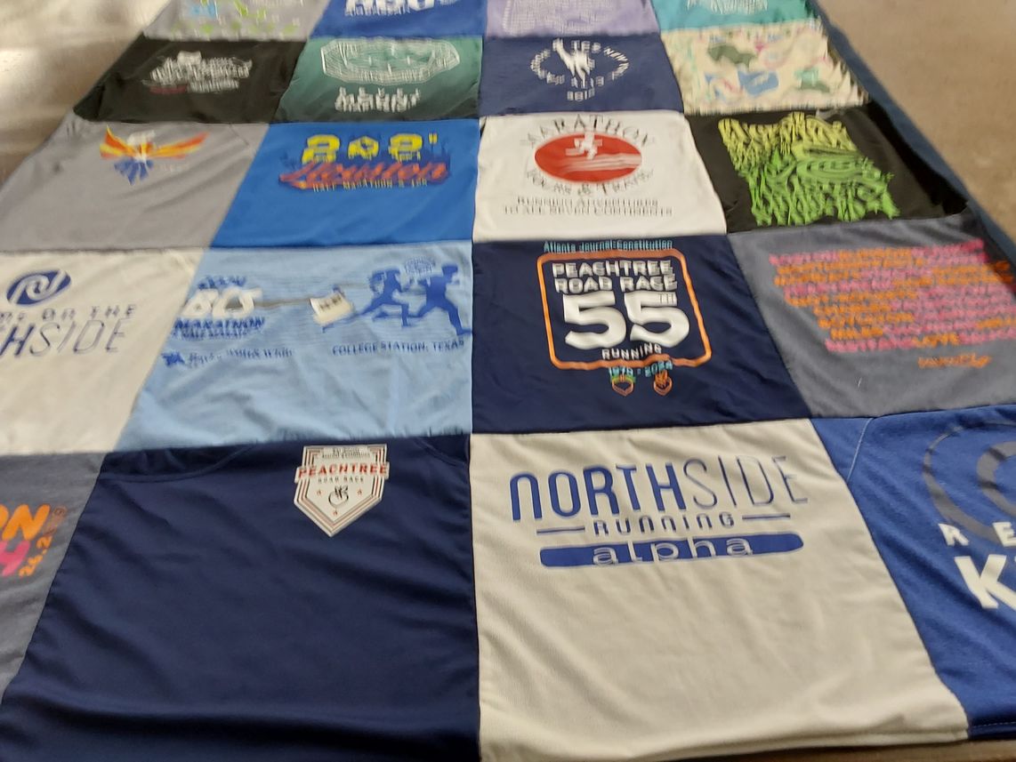 T-shirt quilt with running, athletics themes by Leanne from TX