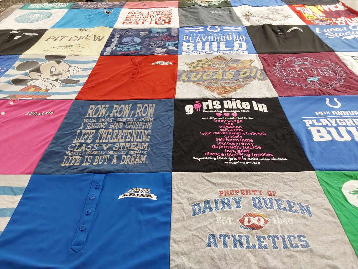 T-shirt quilt with sports, empowerment themes by Kati from IN