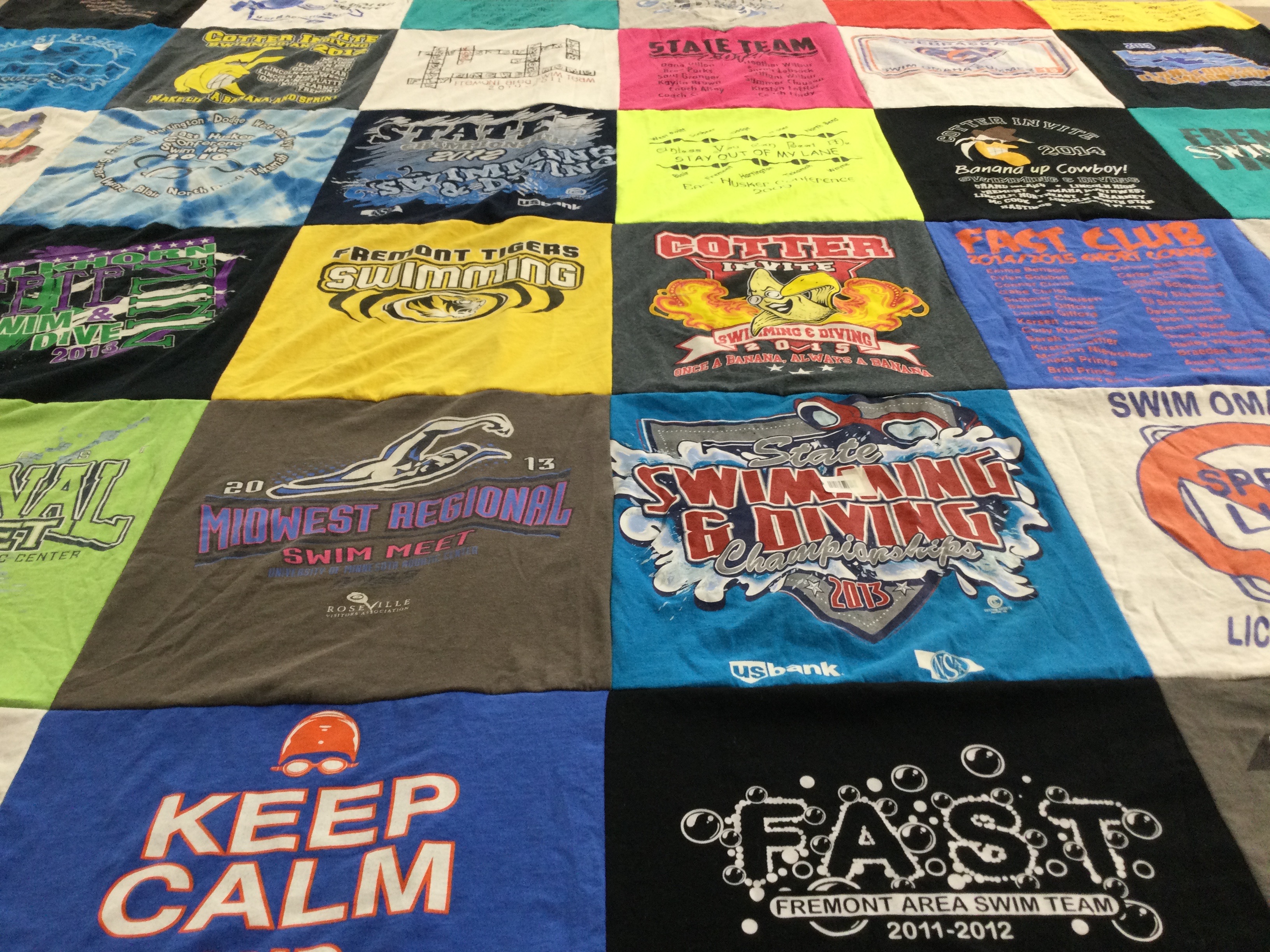 T-shirt quilt featuring fremont area swim team by Peggy from NE
