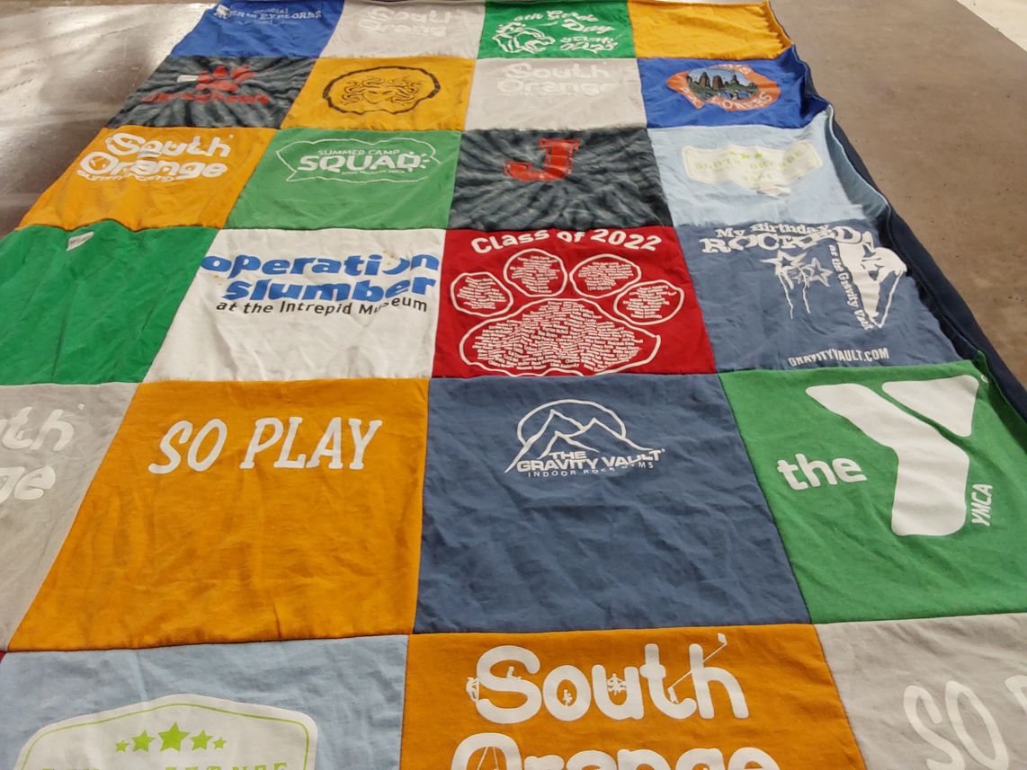 T-shirt quilt with climbing, outdoor activities themes by Kimberly from NJ