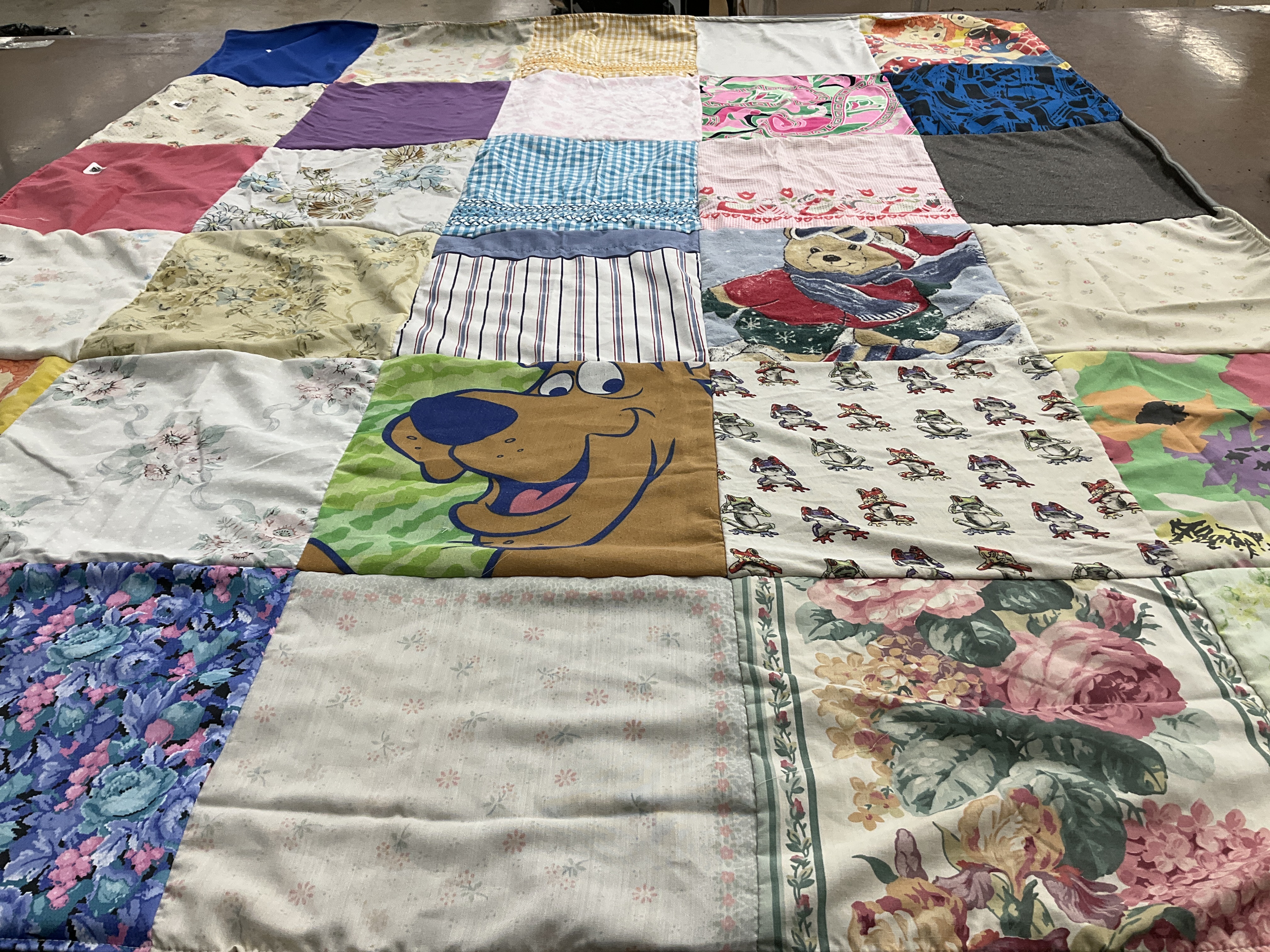 T-shirt quilt with cartoons, flowers themes by Keli from TX