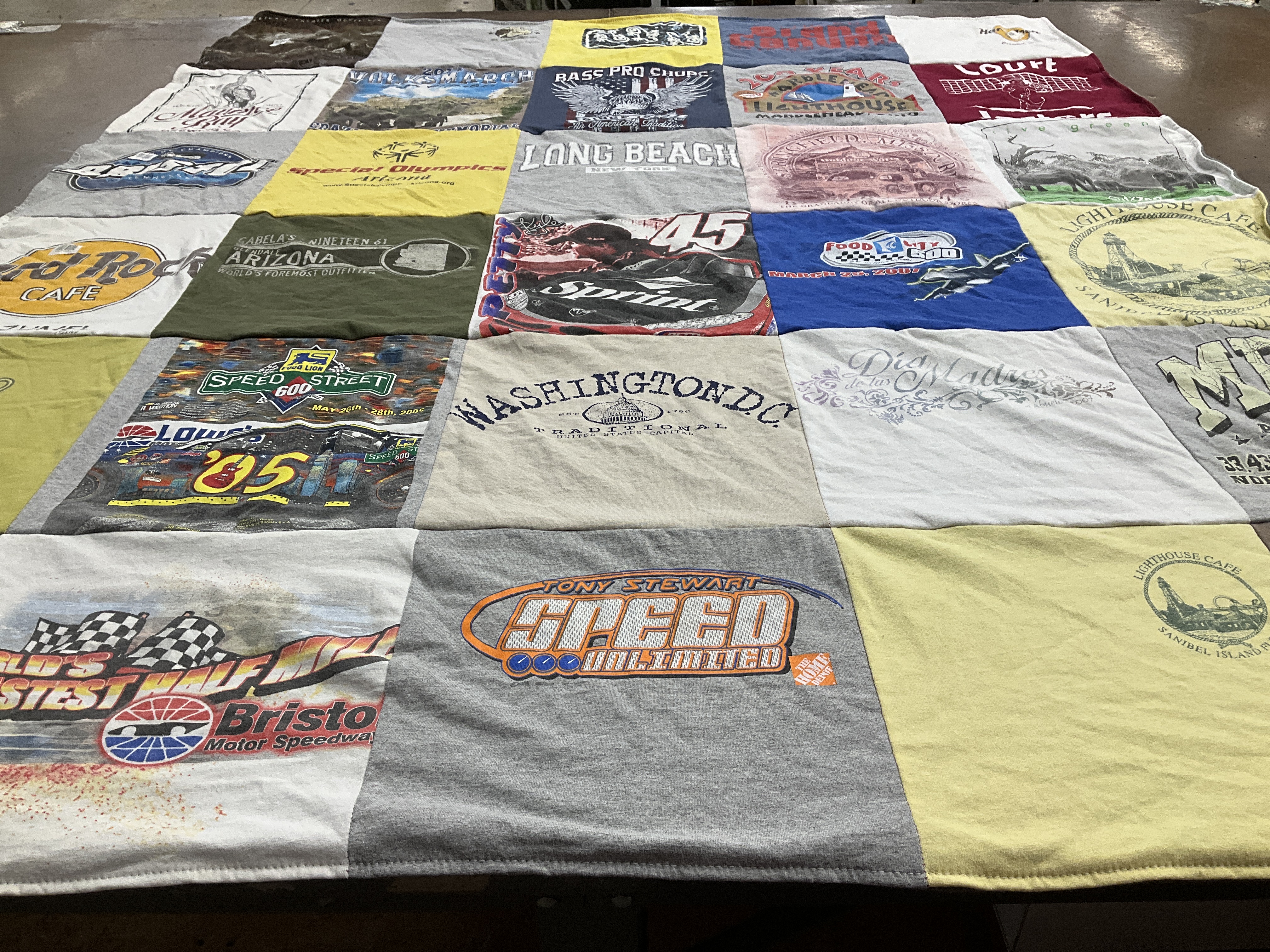 T-shirt quilt with racing, travel themes by Maurine from OH