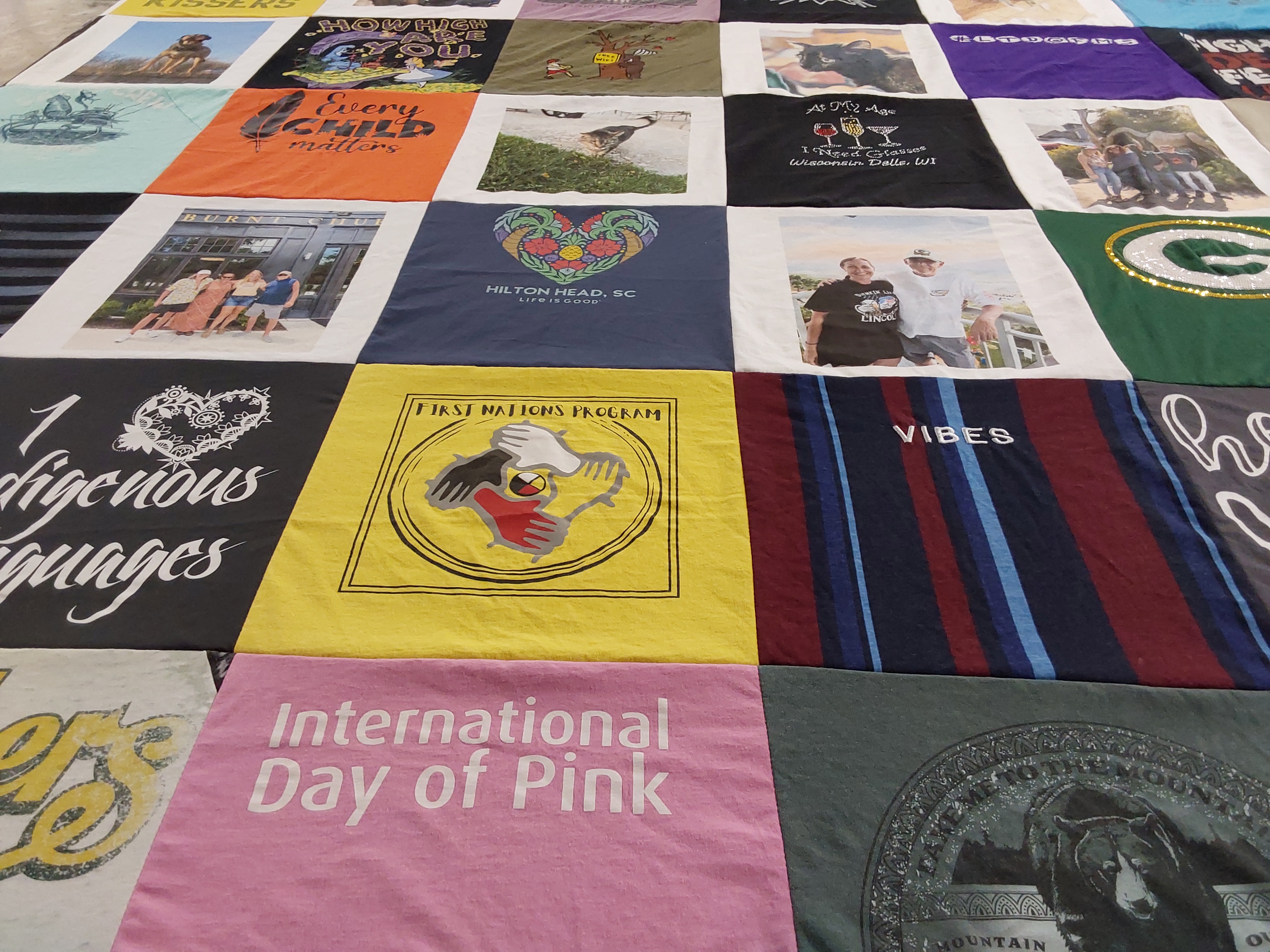 T-shirt quilt with social justice, community support themes by Dawn from WI