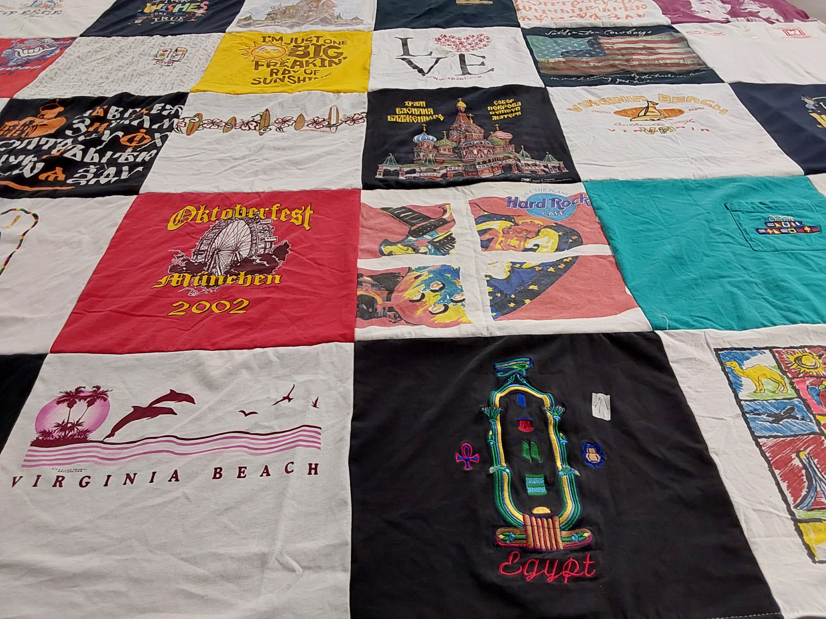 T-shirt quilt with travel, beer festivals themes by Betty from FL