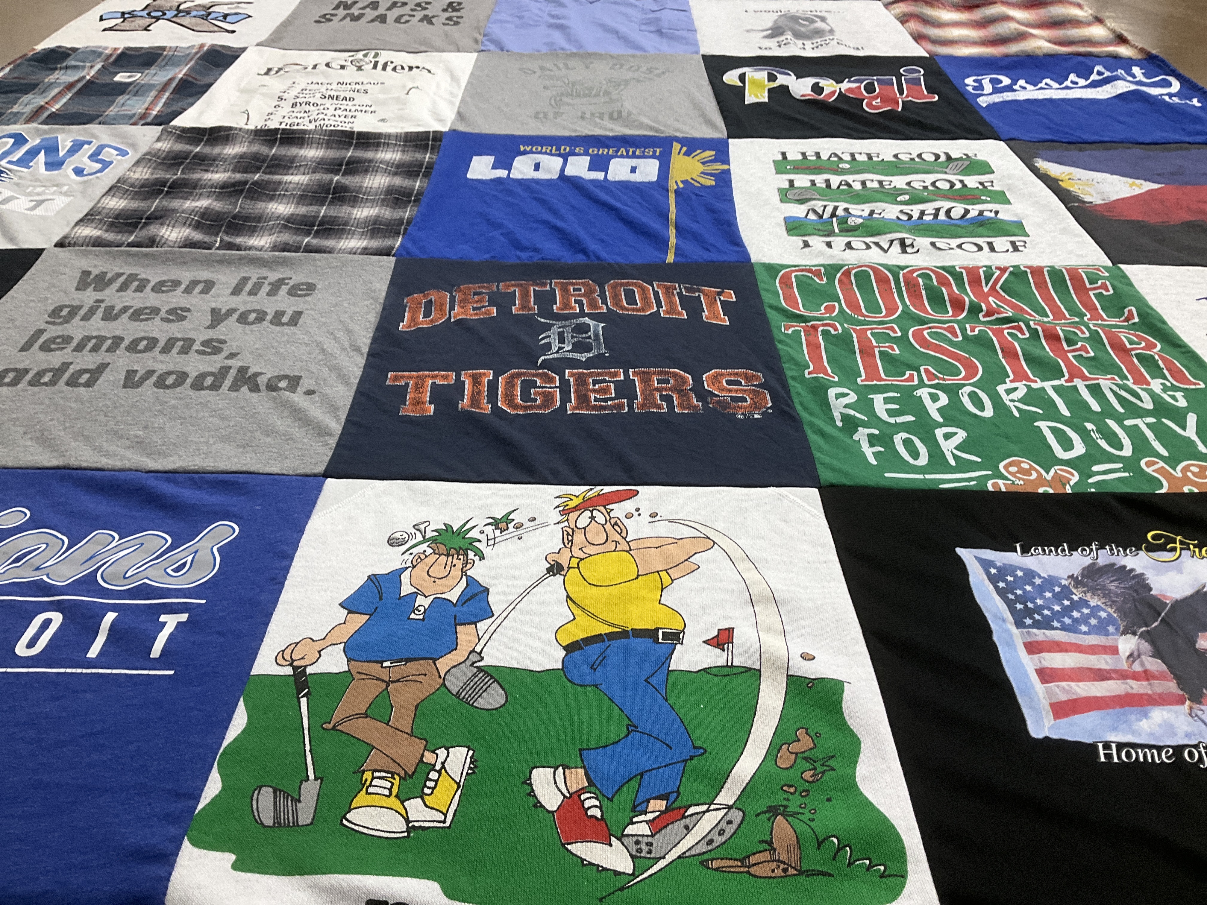 T-shirt quilt with golf, cooking themes by Melissa from MI