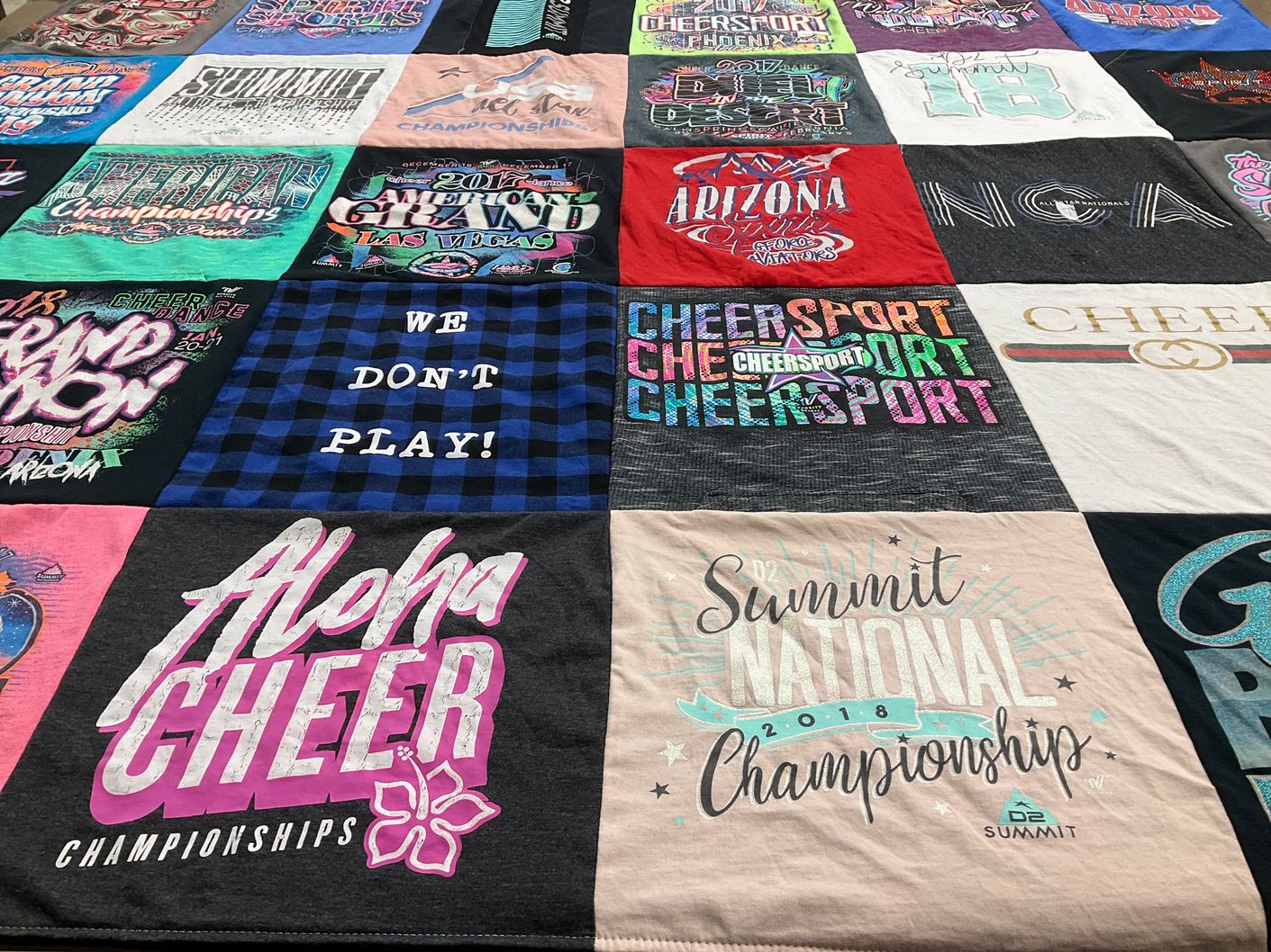 T-shirt quilt with cheerleading, competitions themes by Dawn from AZ