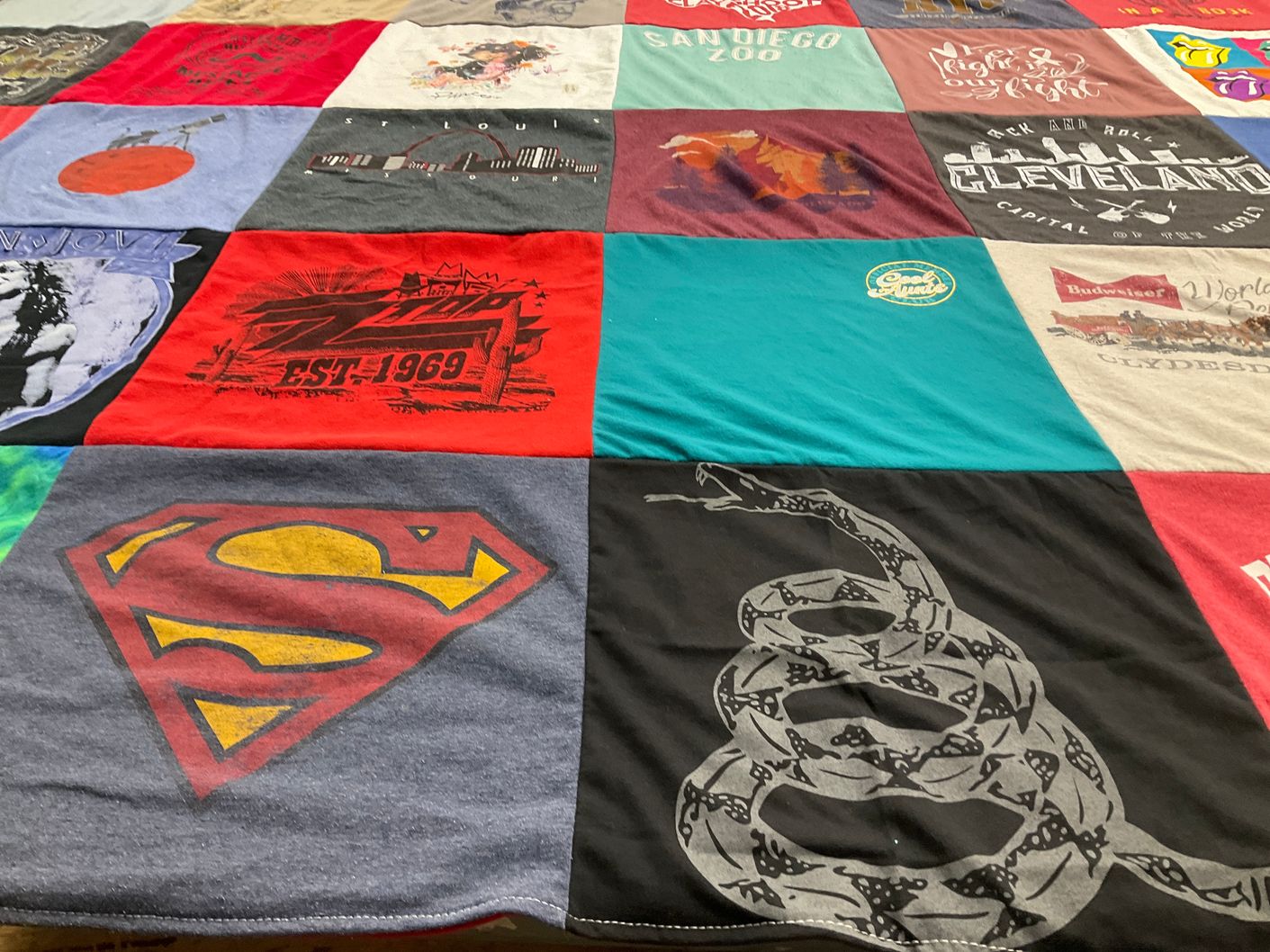T-shirt quilt with travel, music themes by Rachel Garcia from TX