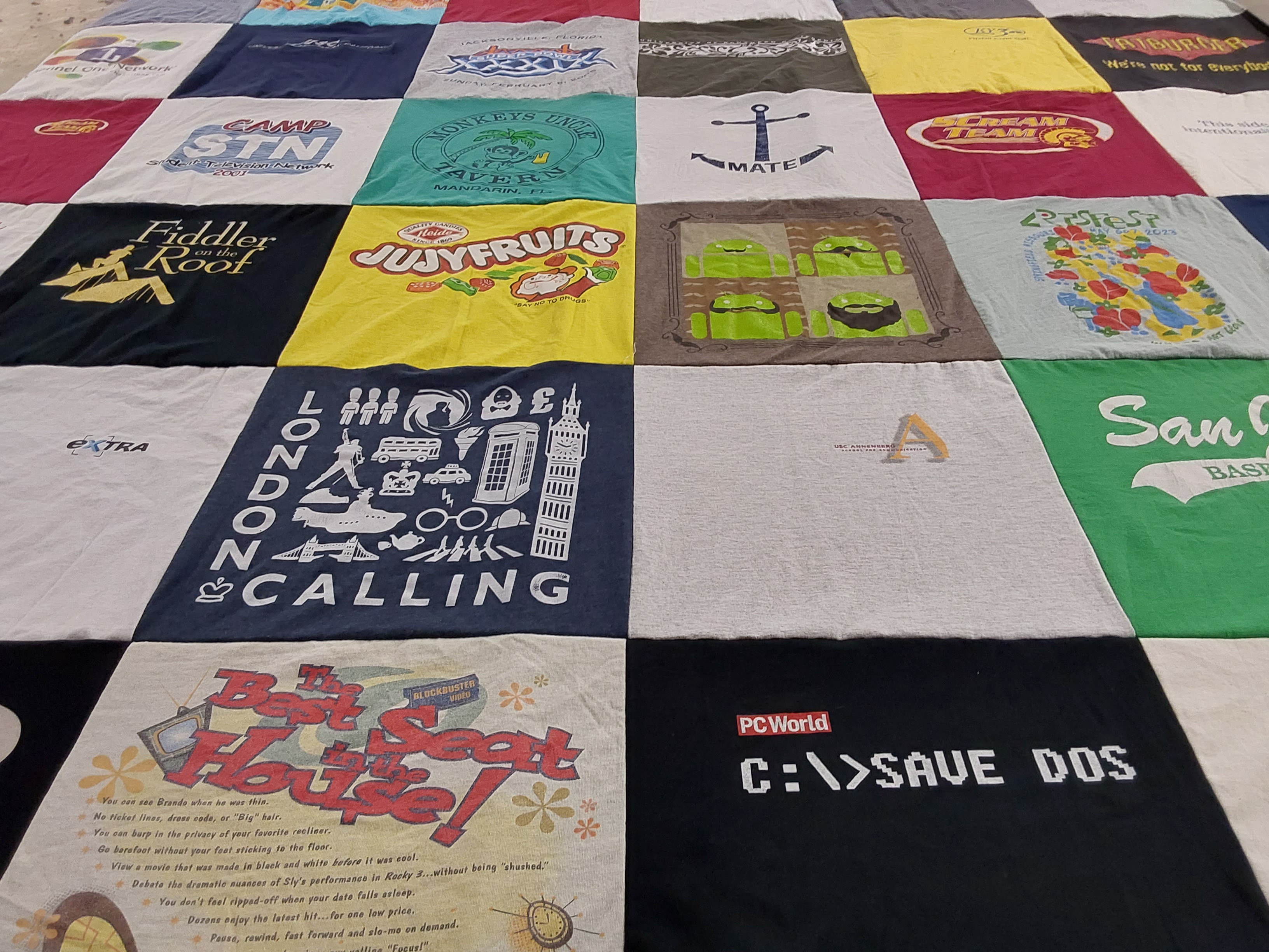 T-shirt quilt with theater, technology themes by Jason from CA