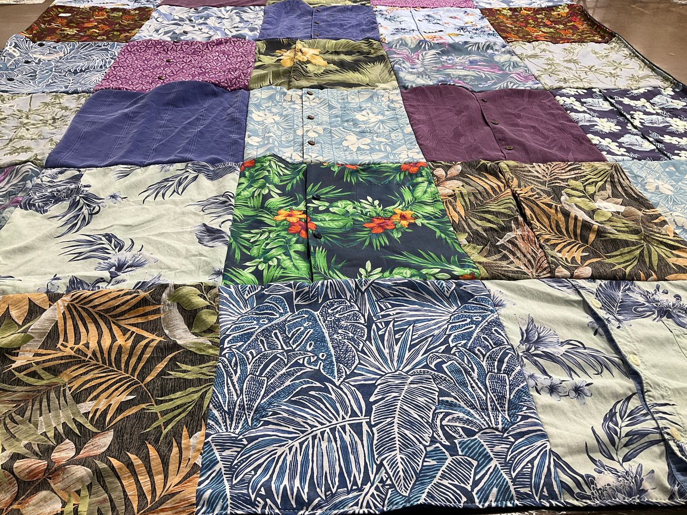 T-shirt quilt with quilting, sustainability themes by Anne from CT