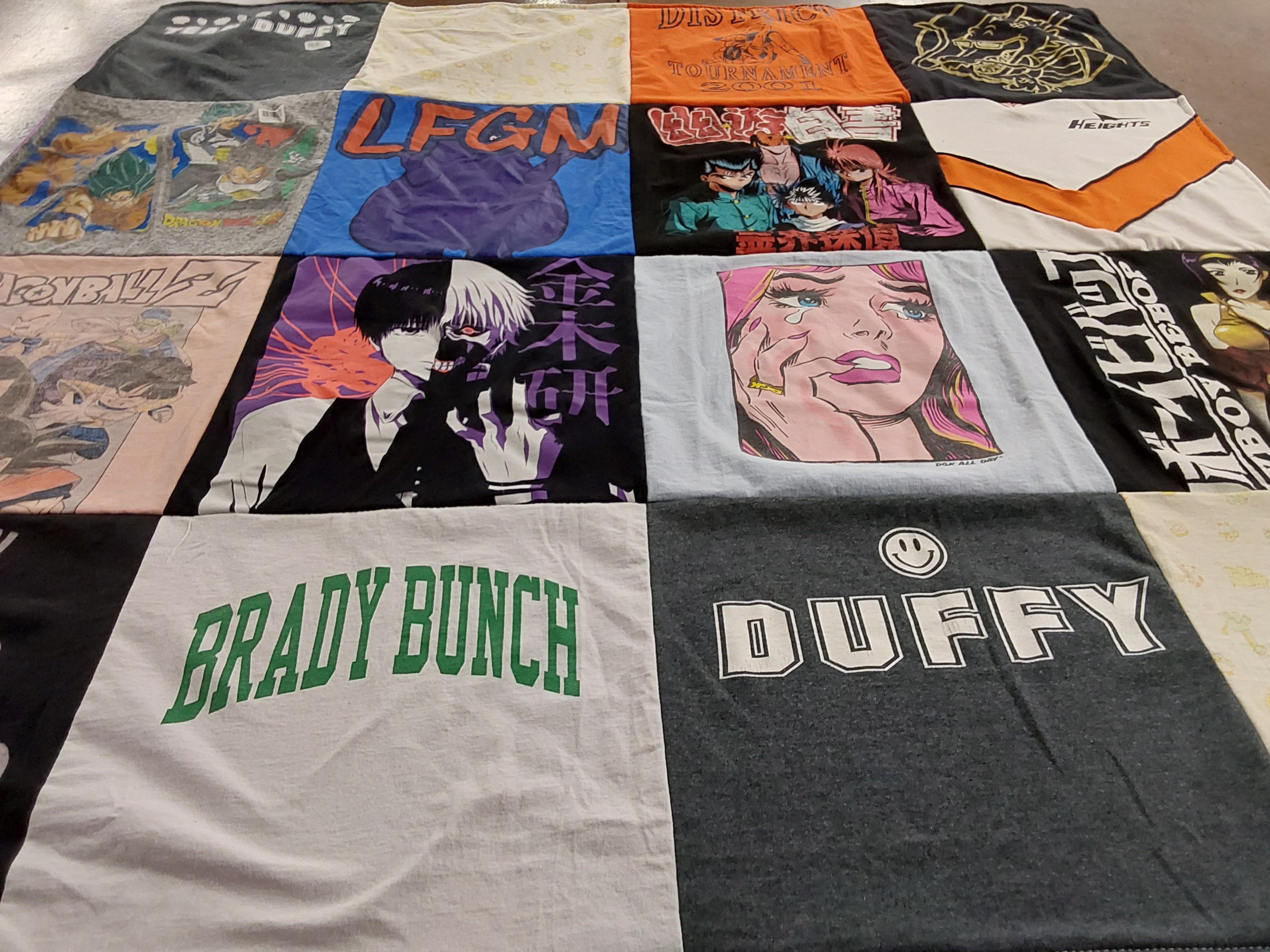 T-shirt quilt with anime, pop culture themes by Patricia from NJ