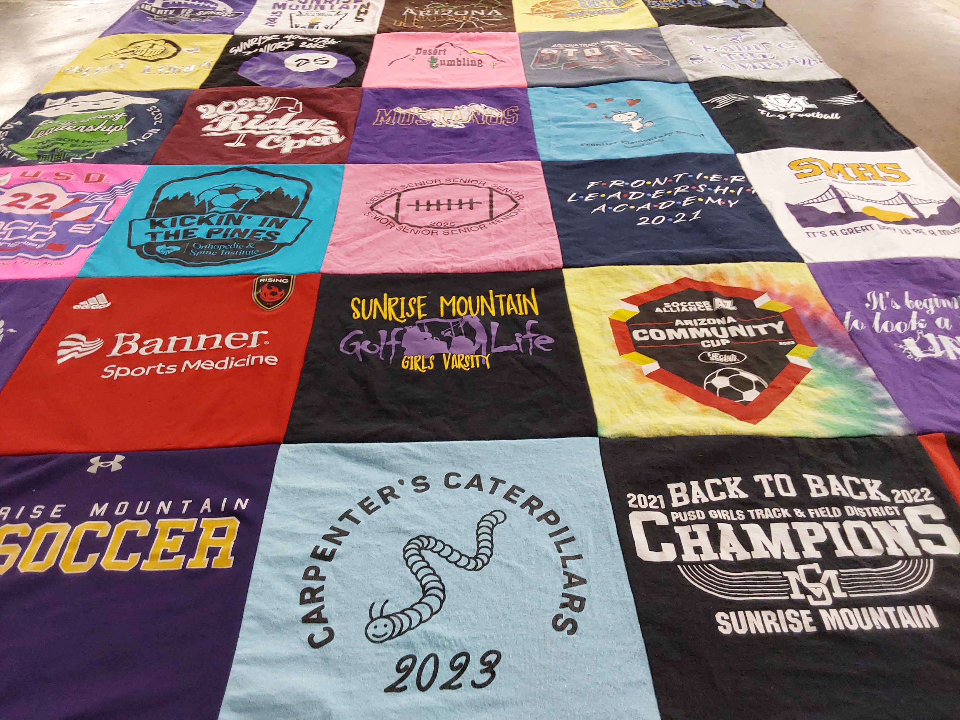 T-shirt quilt featuring sunrise mountain girls varsity by erika from AZ