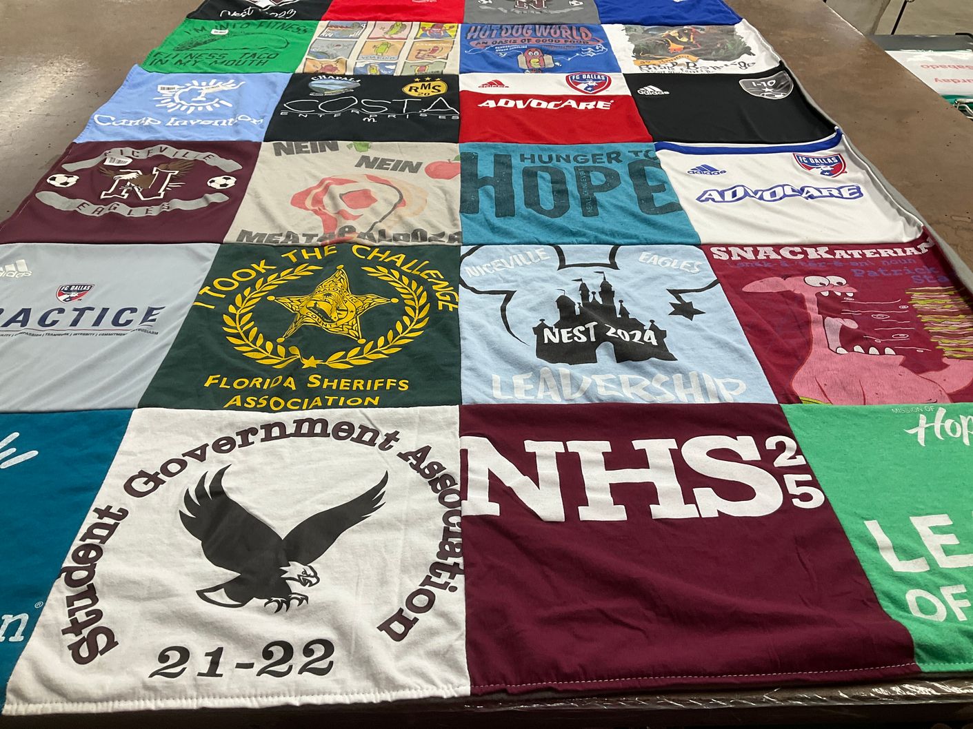 T-shirt quilt with law enforcement, student government themes by Ryann from FL