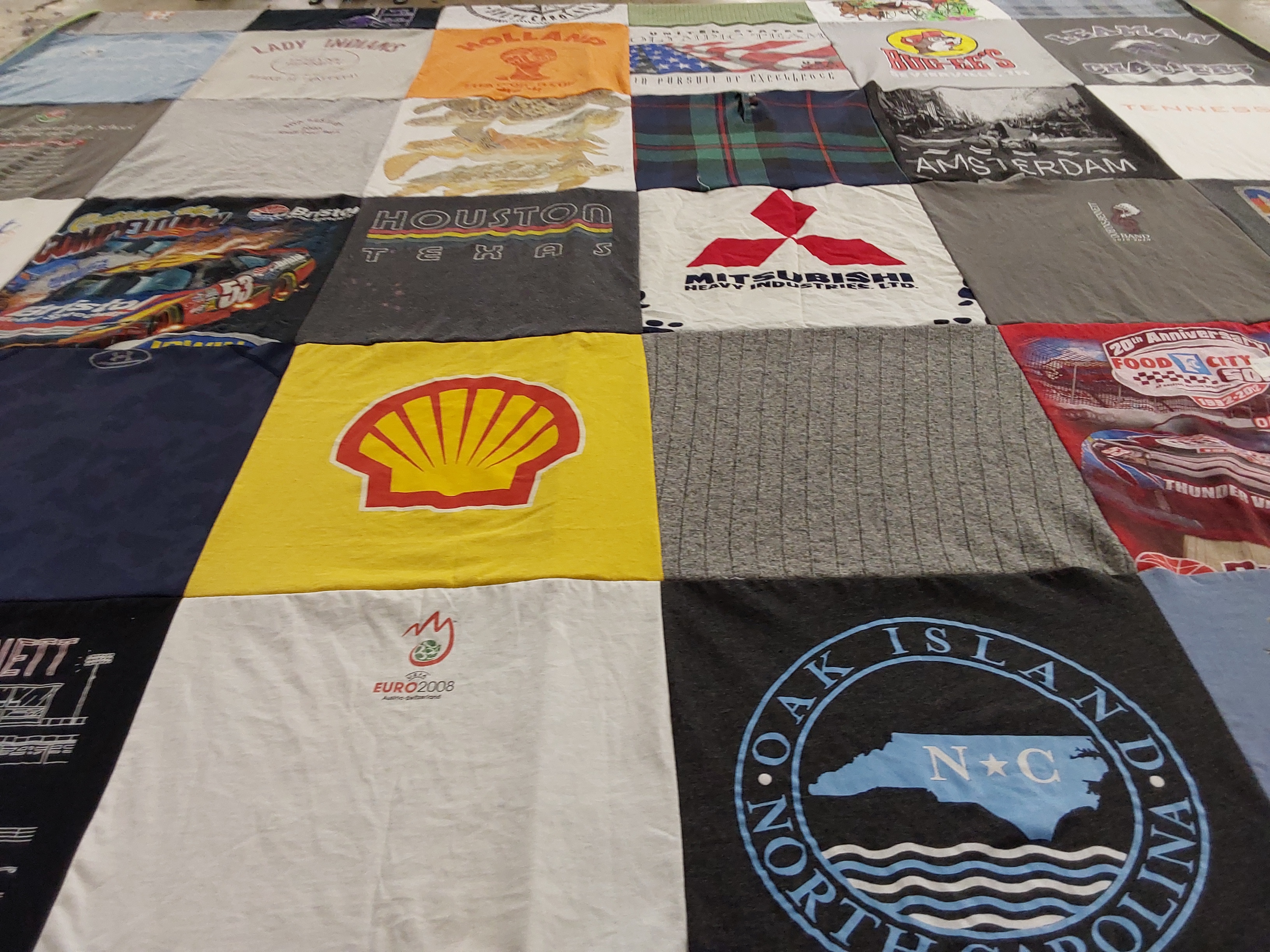 T-shirt quilt with racing, travel themes by Mia from TN