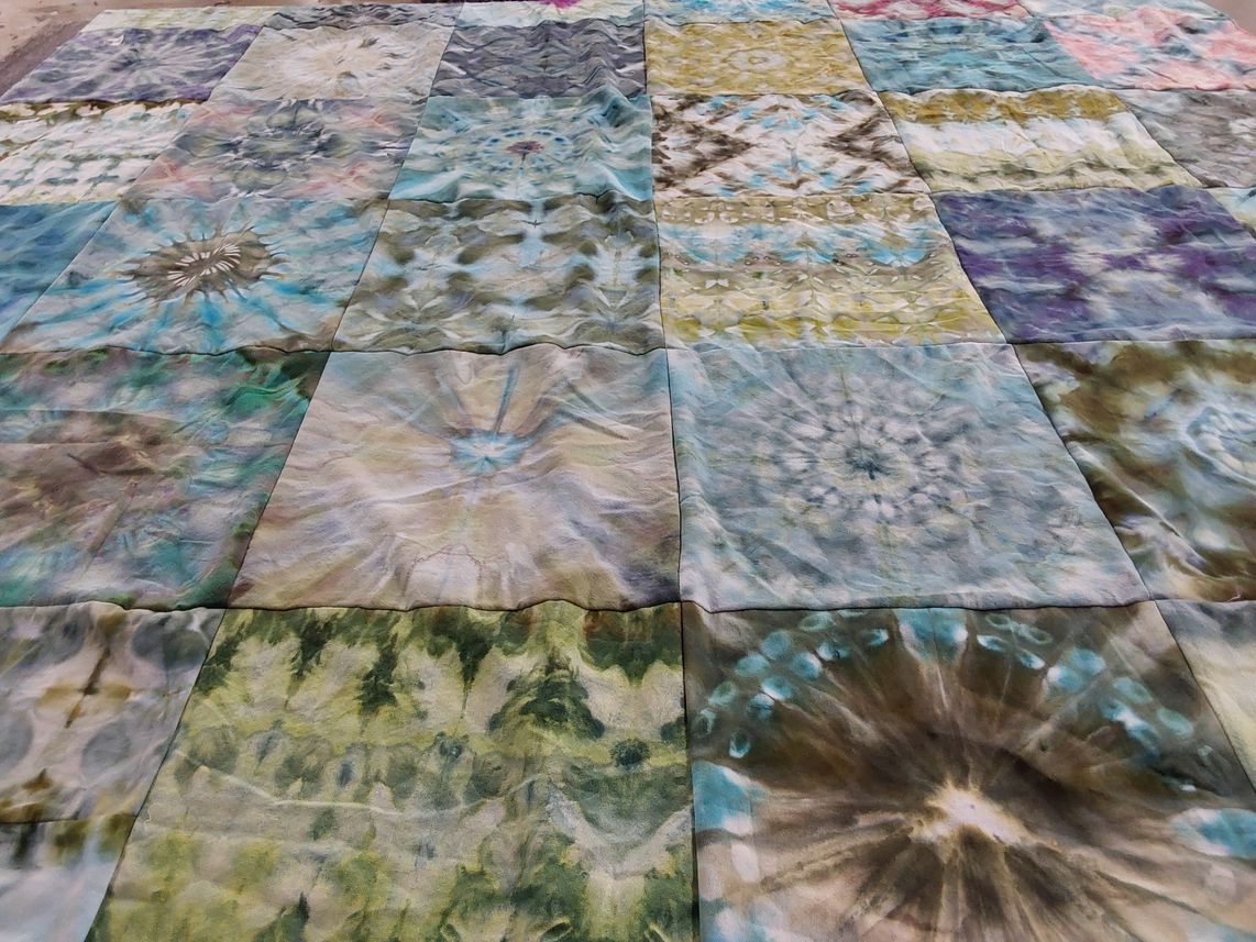 T-shirt quilt with fabric art, textile design themes by Sharyn from NY