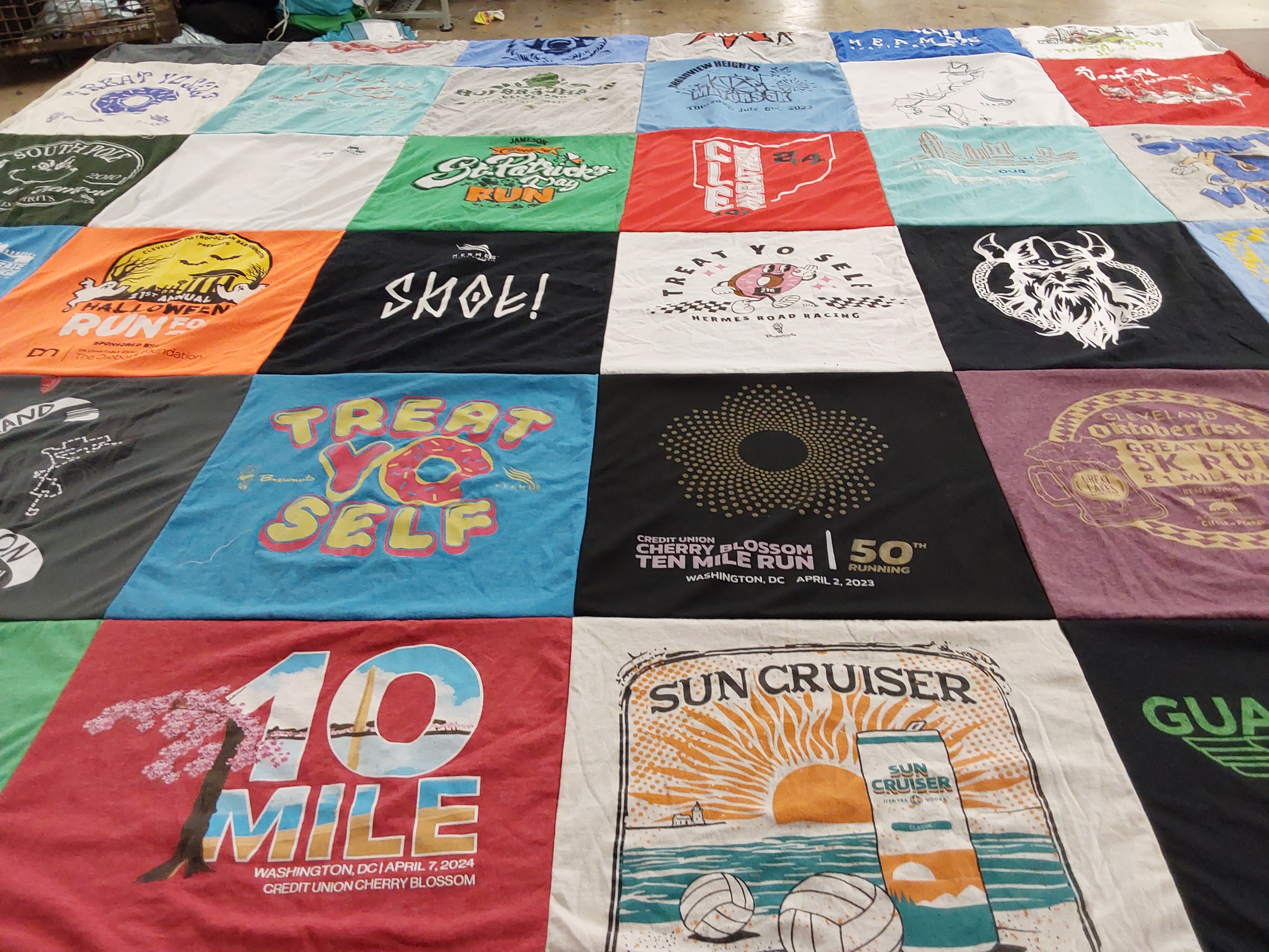 T-shirt quilt with running, festivals themes by Molly from OH