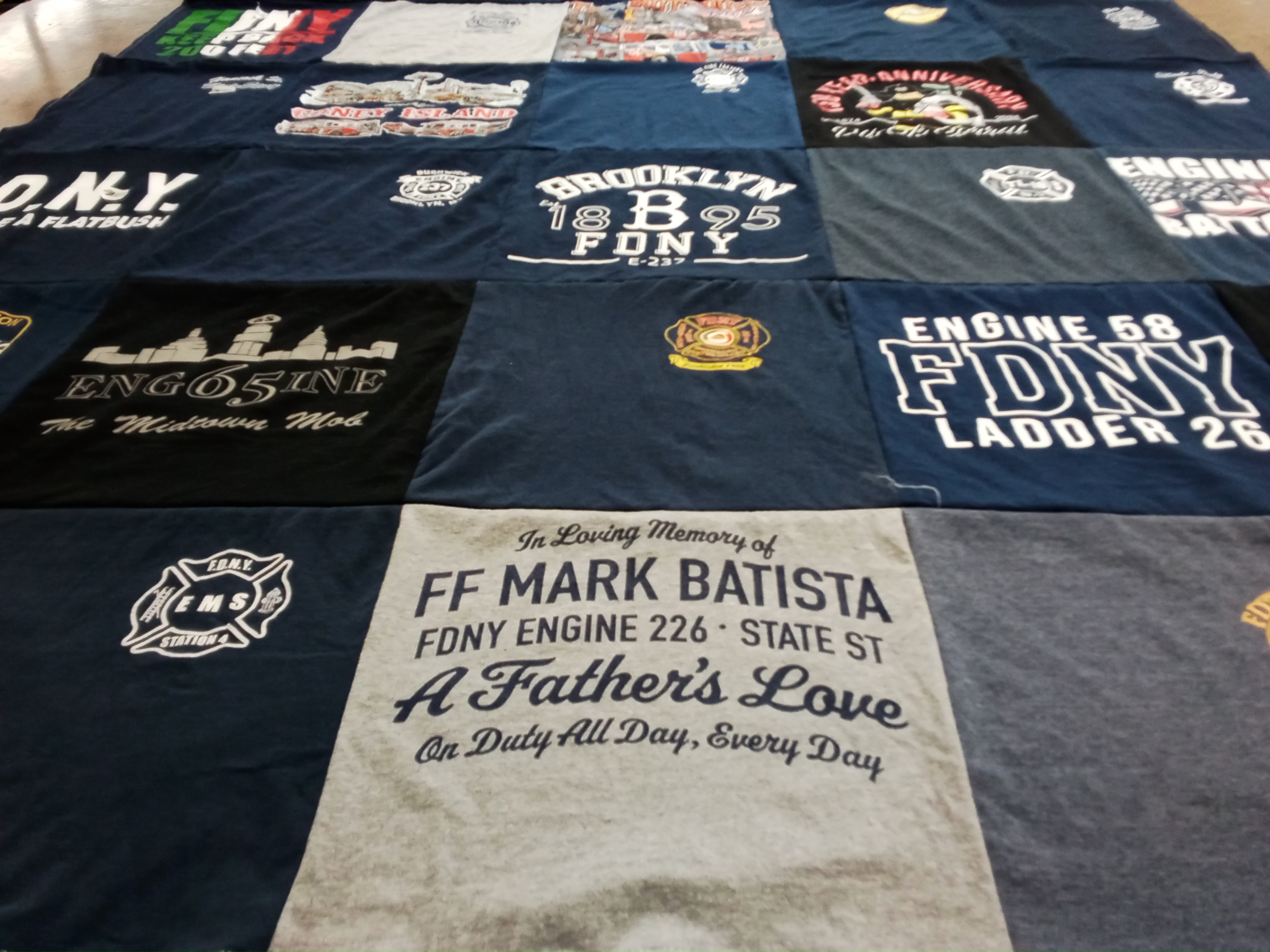 T-shirt quilt with firefighting, emergency services themes by Dominique from NY