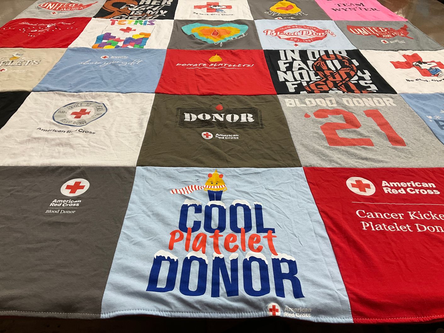 T-shirt quilt with blood donation, cancer awareness themes by Lisa from ME