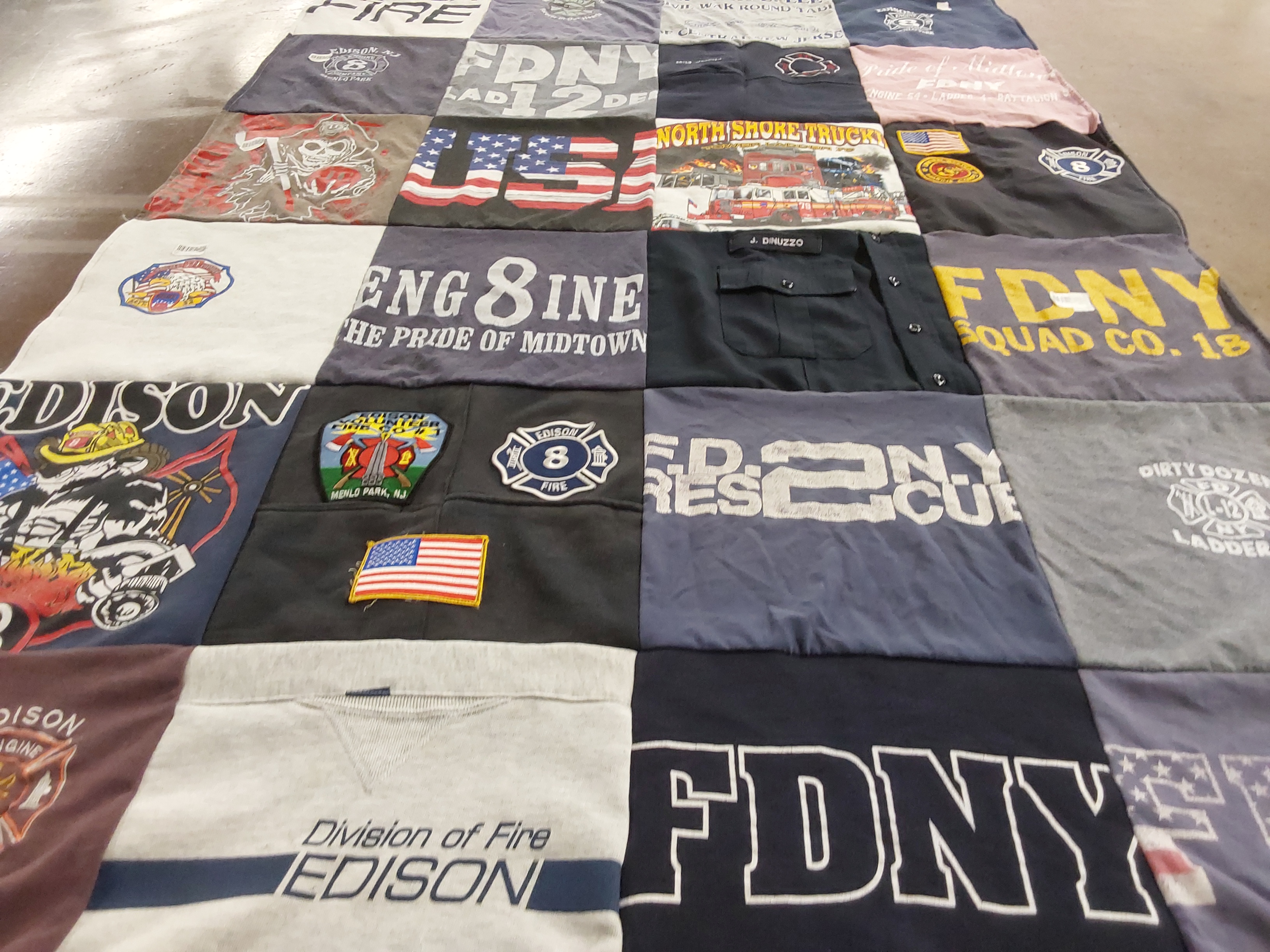 T-shirt quilt with firefighting, emergency services themes by Brynn from NJ