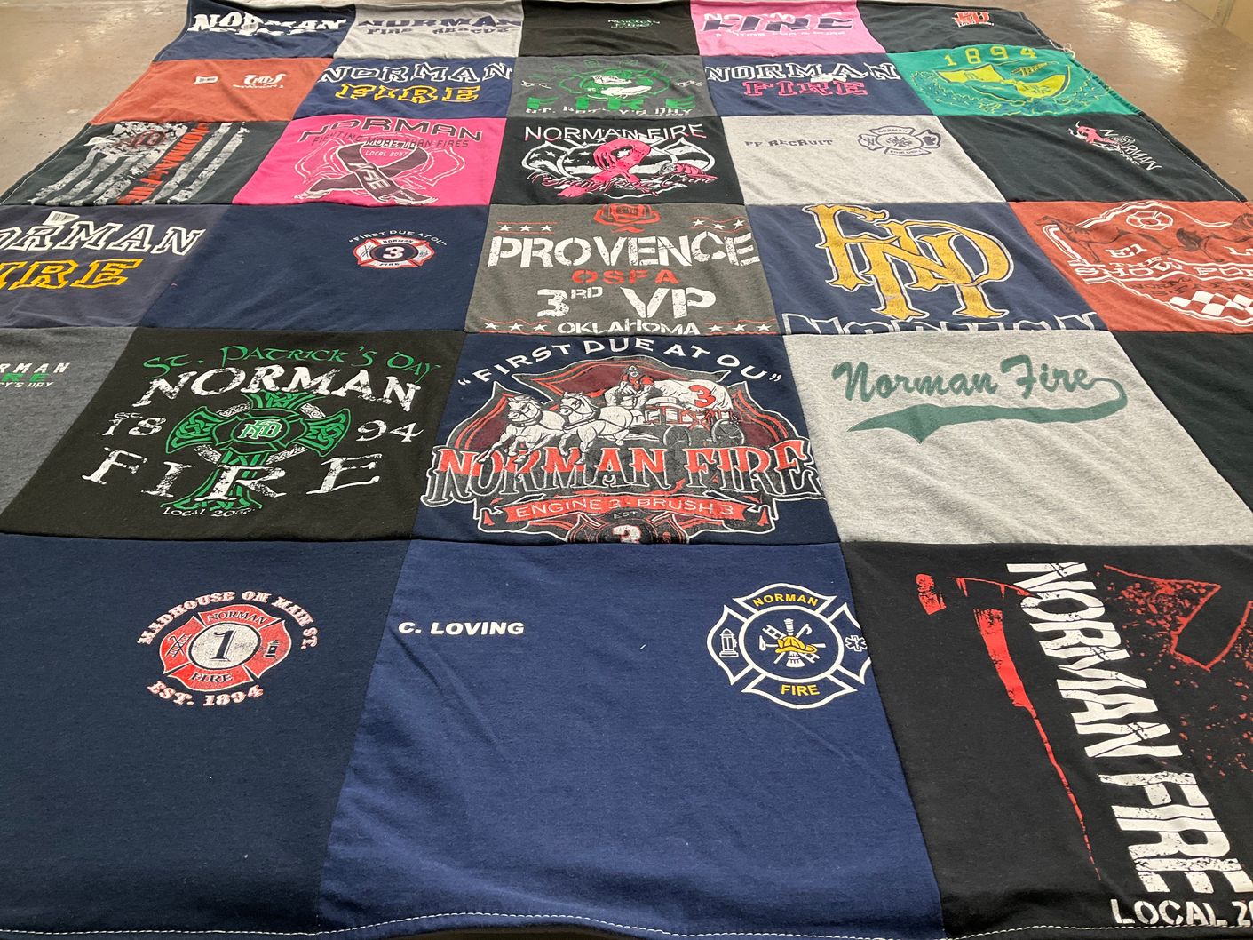 T-shirt quilt with firefighting, community service themes by Teresa from OK