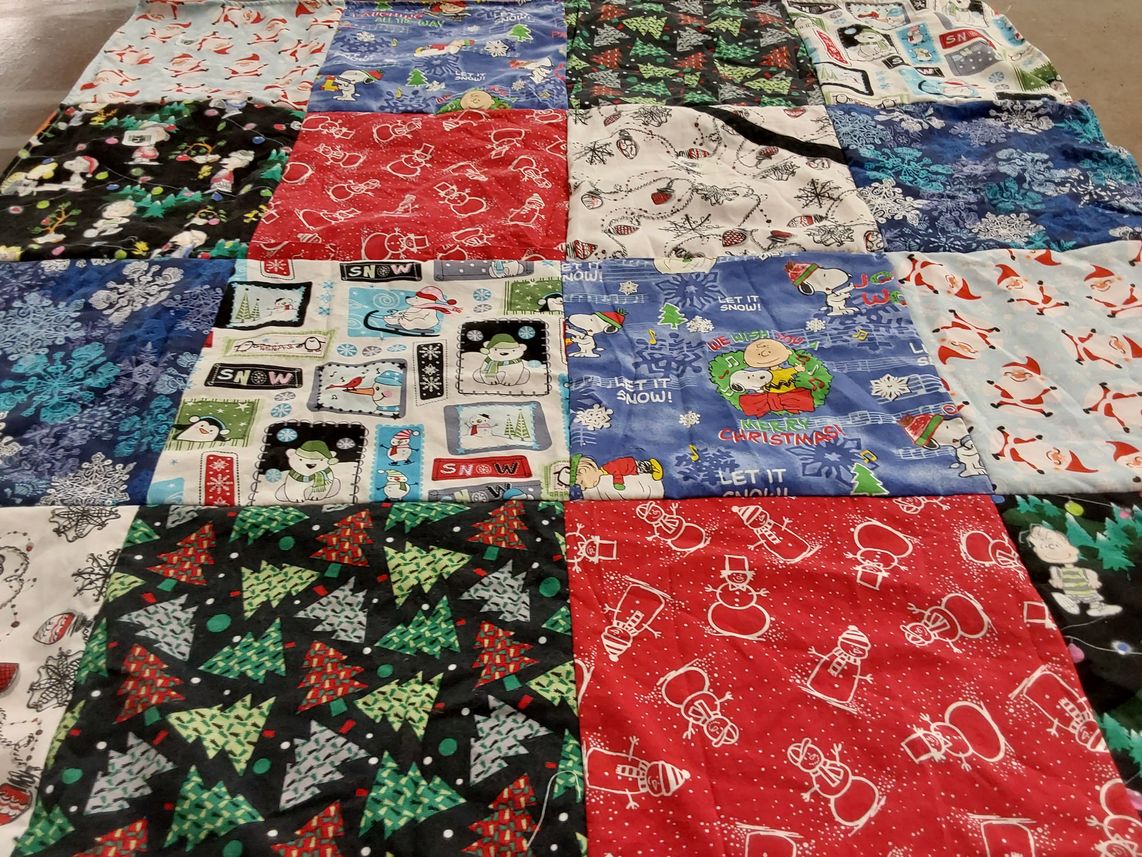 T-shirt quilt with winter festivities, holiday celebrations themes by Patricia from NJ