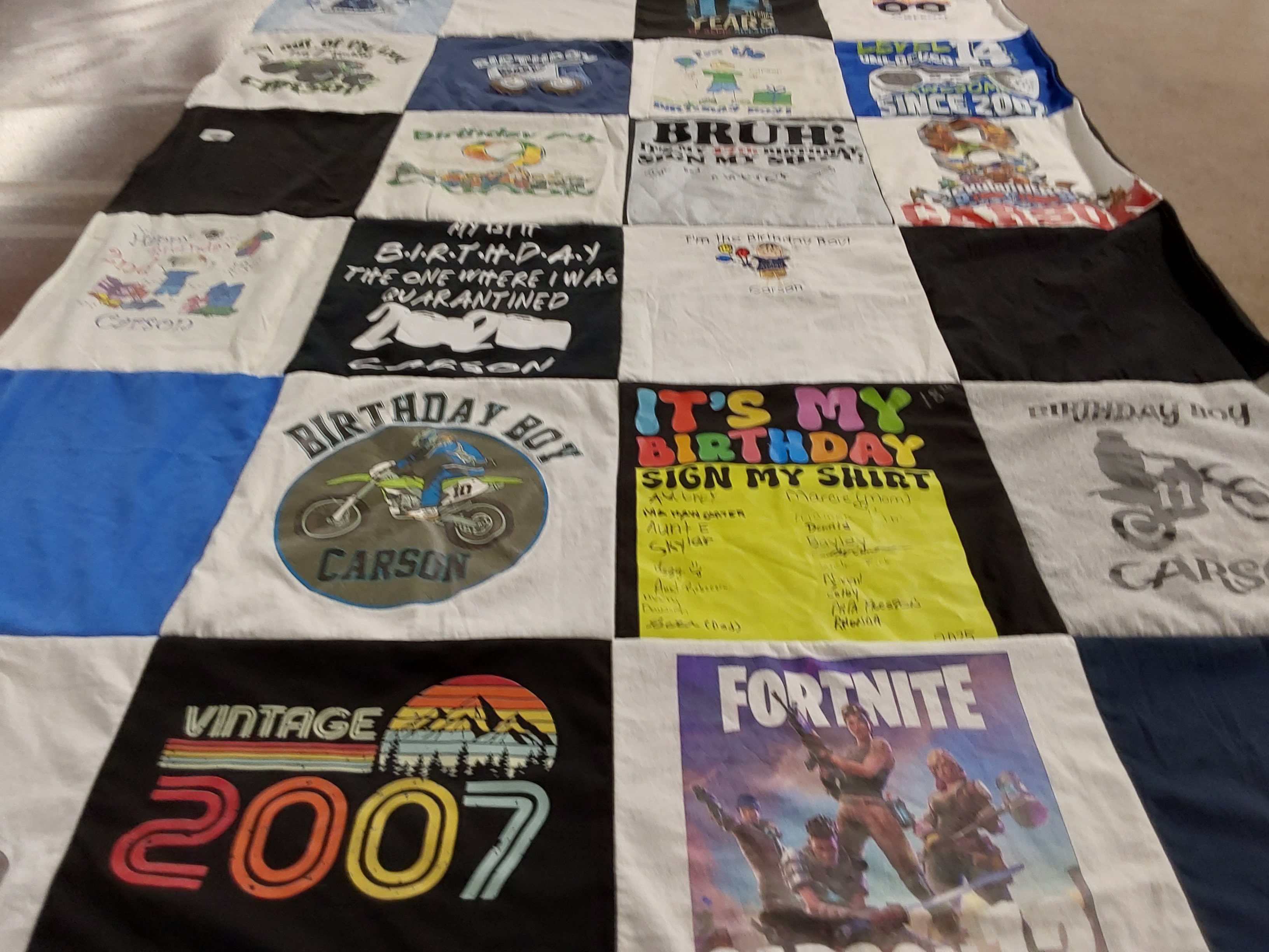 T-shirt quilt with birthdays, gaming themes by Marcie  from NC