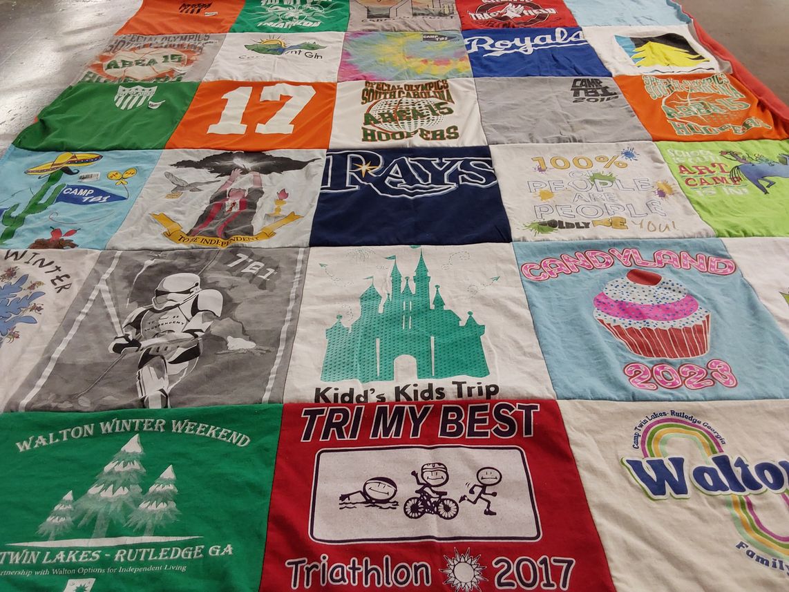 T-shirt quilt with camping, sports themes by Taina from SC