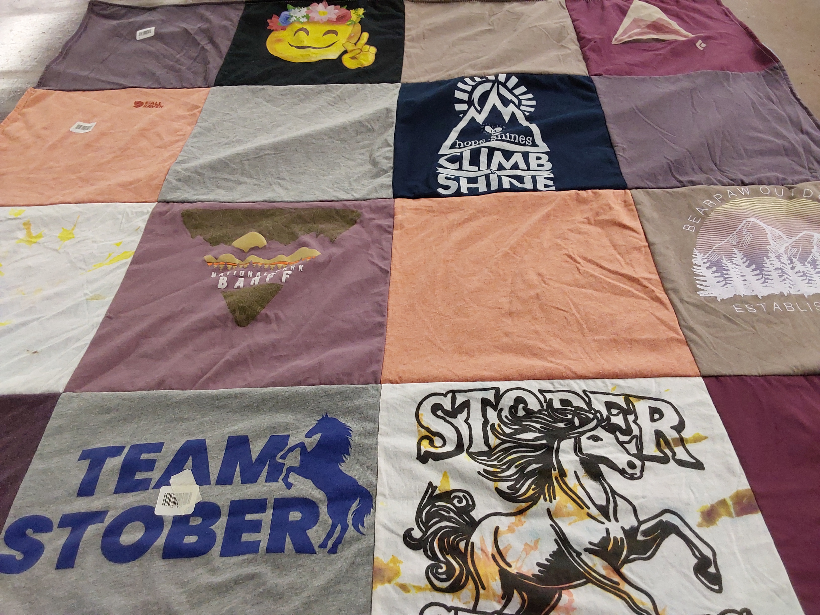 T-shirt quilt with outdoor activities, mountain climbing themes by B Jane from CO