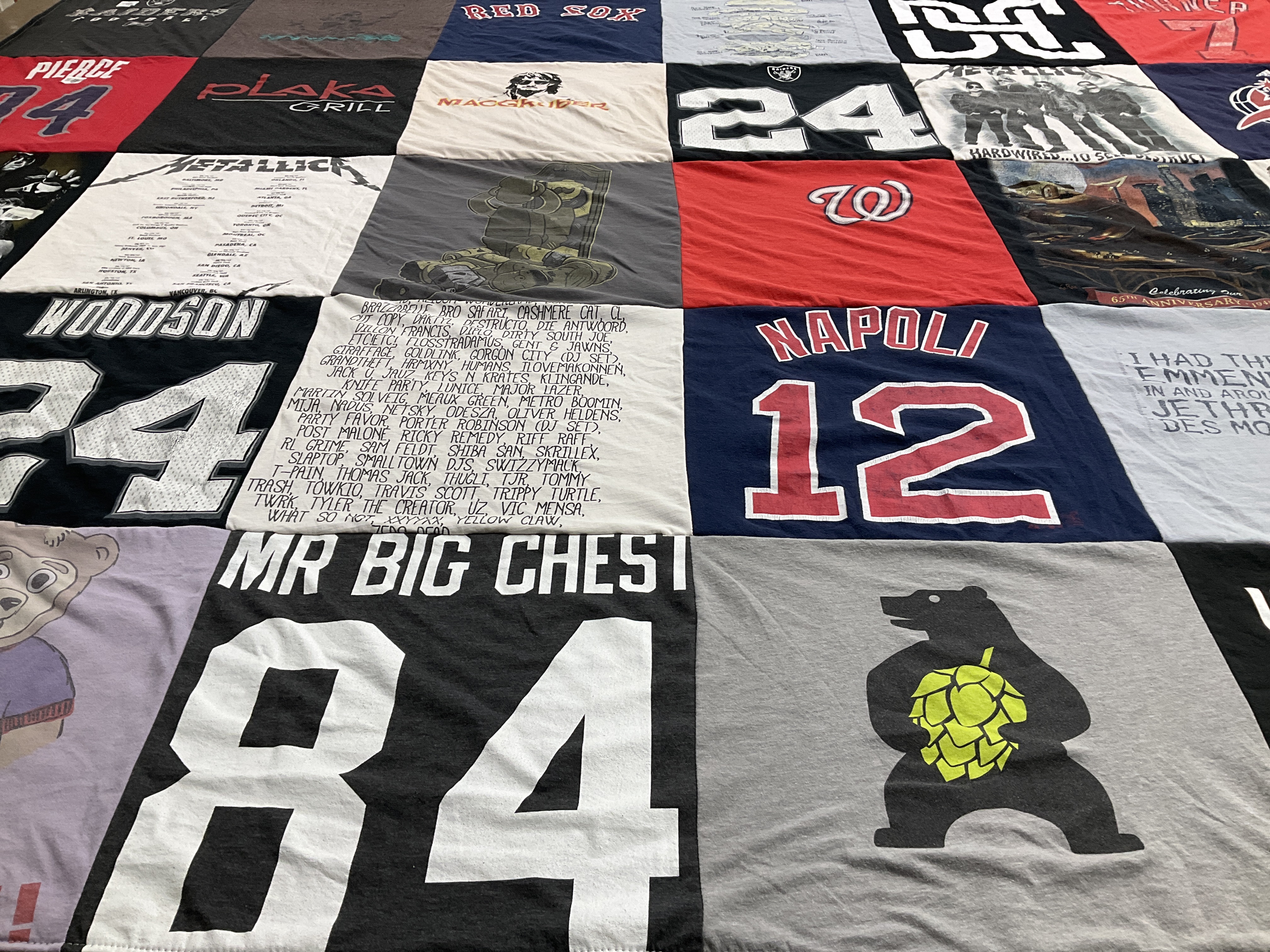 T-shirt quilt with sports, music themes by Rachel from NJ