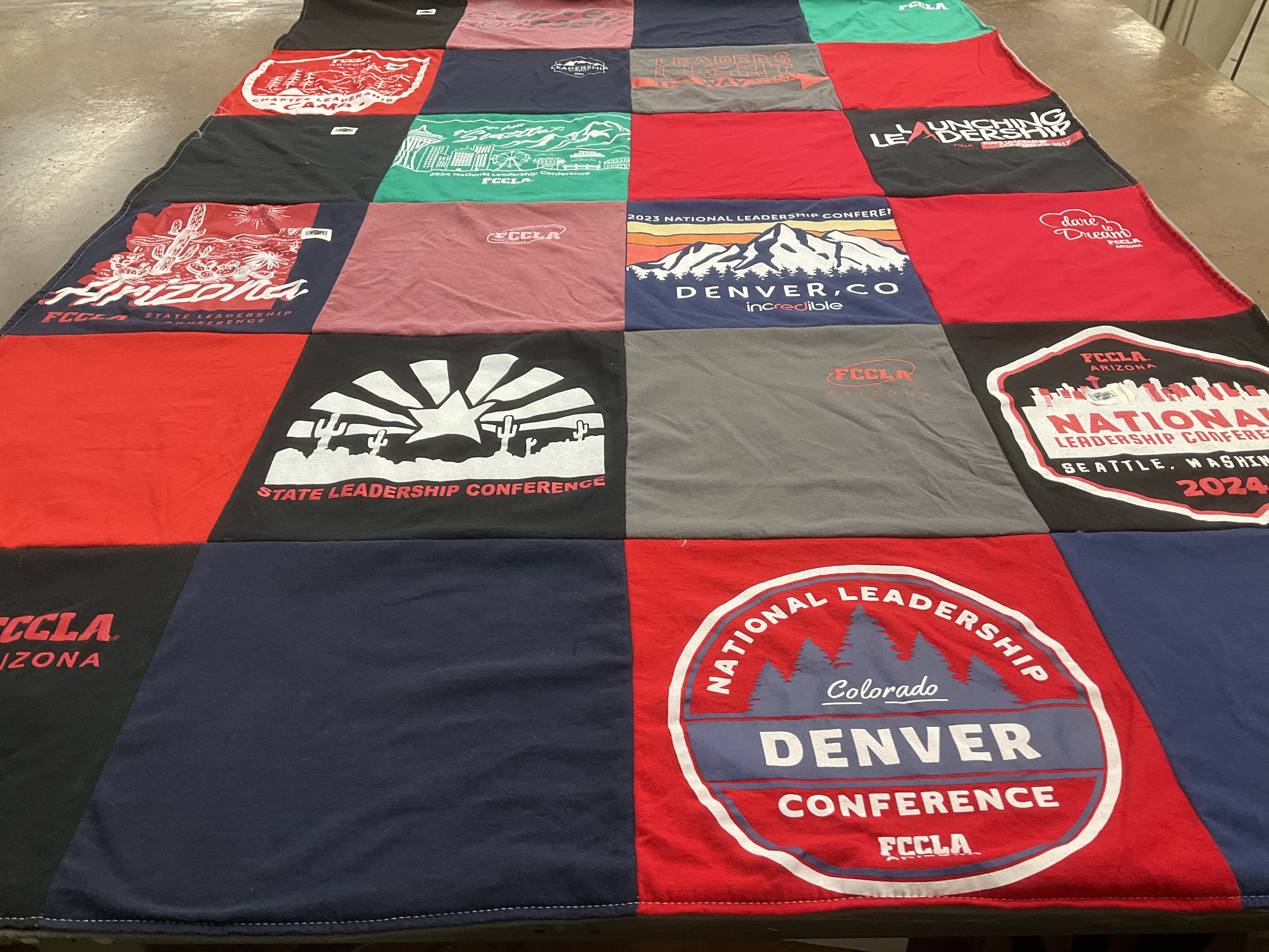 T-shirt quilt with leadership, conferences themes by Laura from AZ